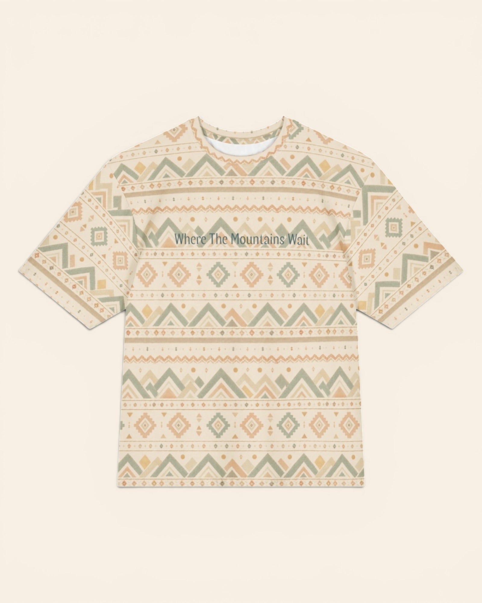 Where The Mountains Wait Oversized Tee, with mountain-inspired geometric bands in sage, sand, and peach print
