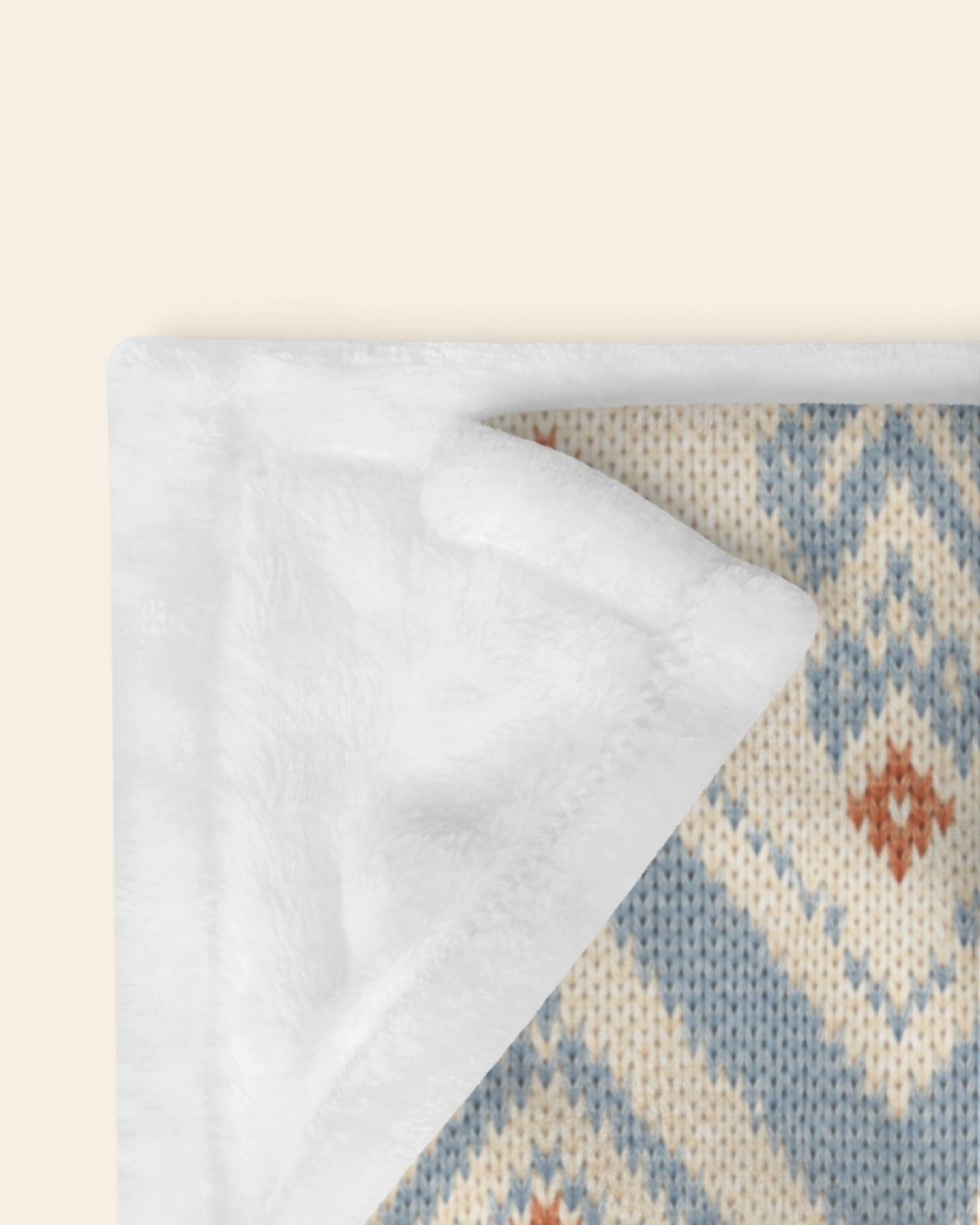 The Alpine Hours Throw Blanket, with mountain-inspired diamonds and rust accents print