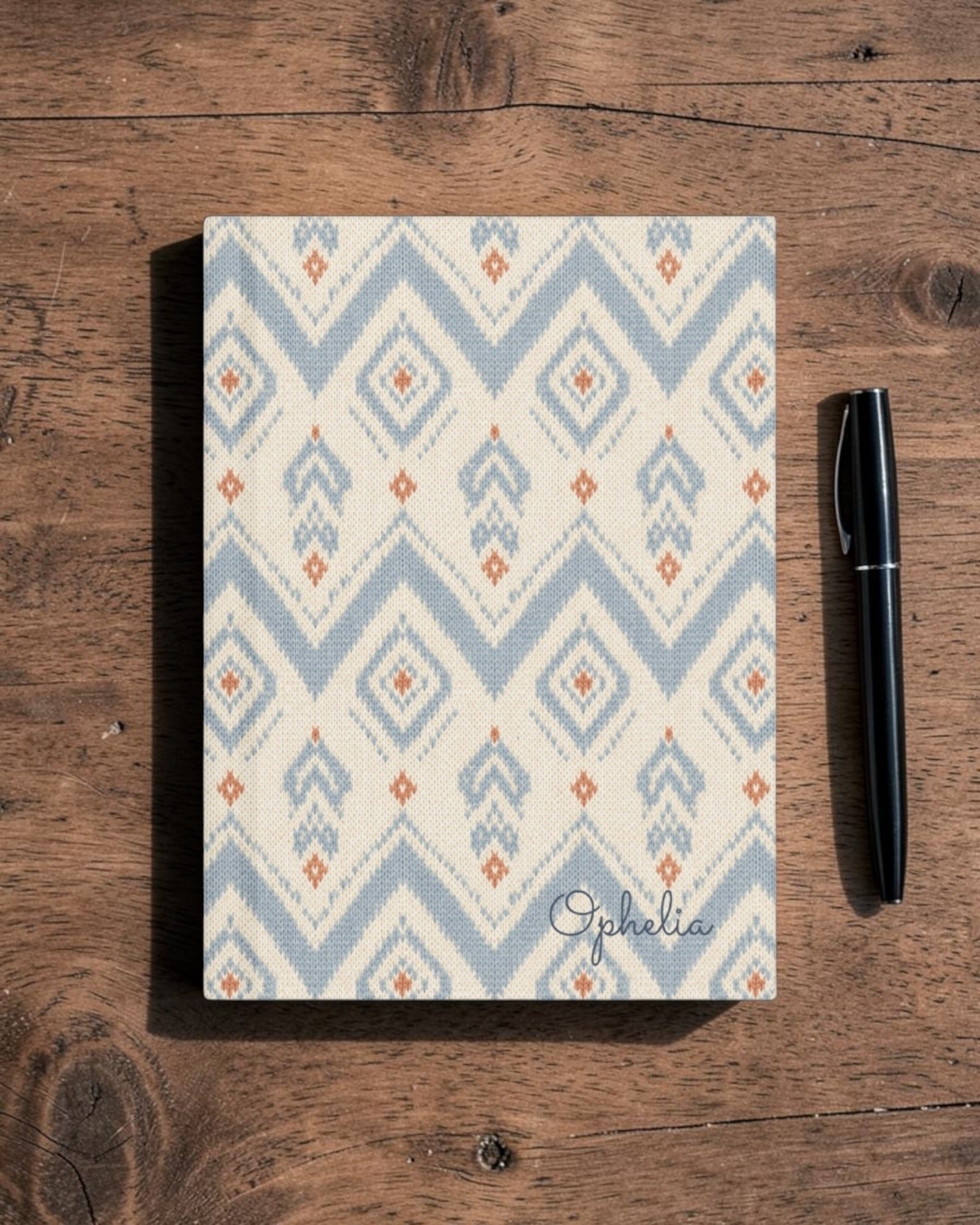 The Alpine Hours Journal, with mountain-inspired diamonds and rust accents print