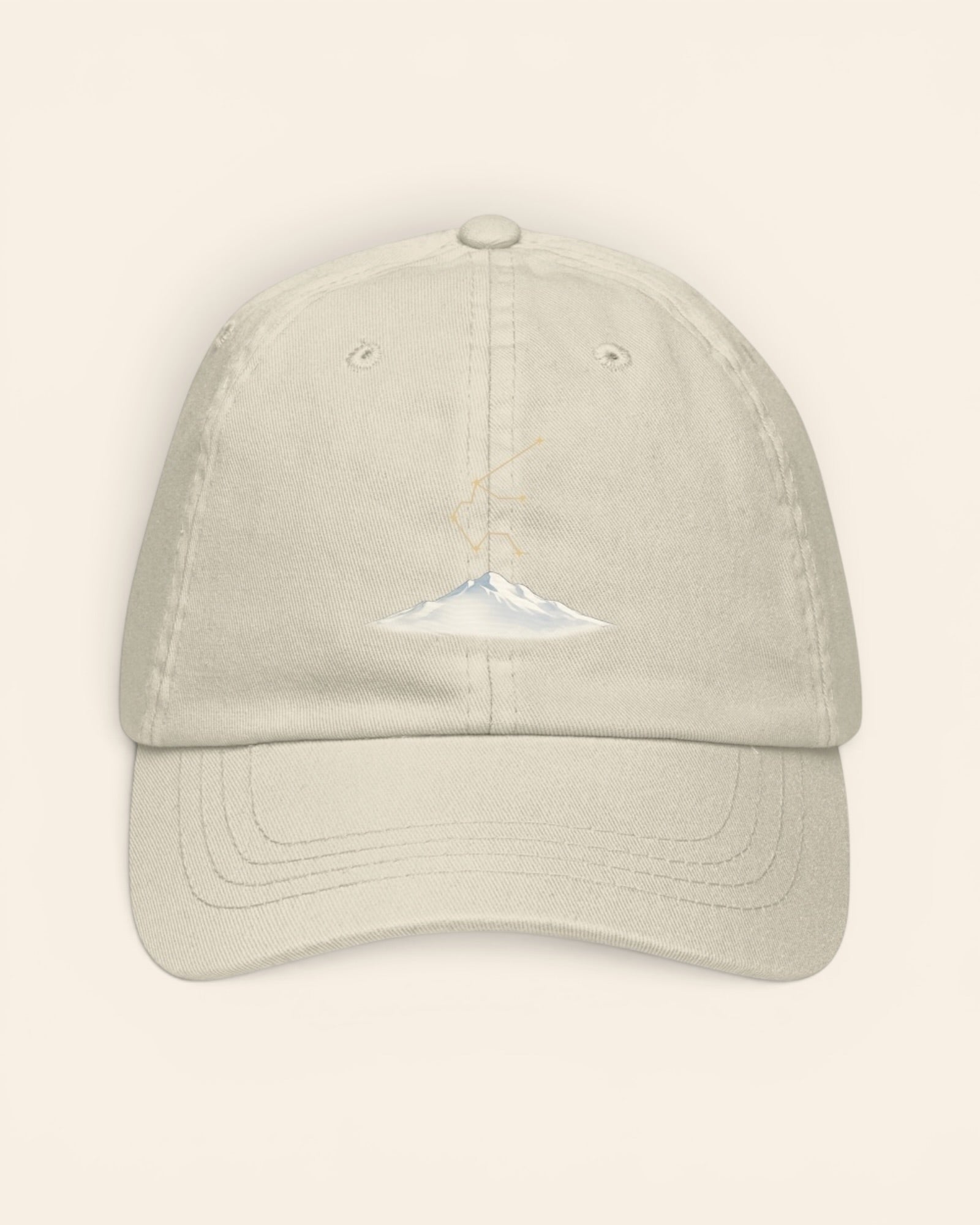 Aquarius constellation hat with embroidered stars above a mountain ridge, in Beige