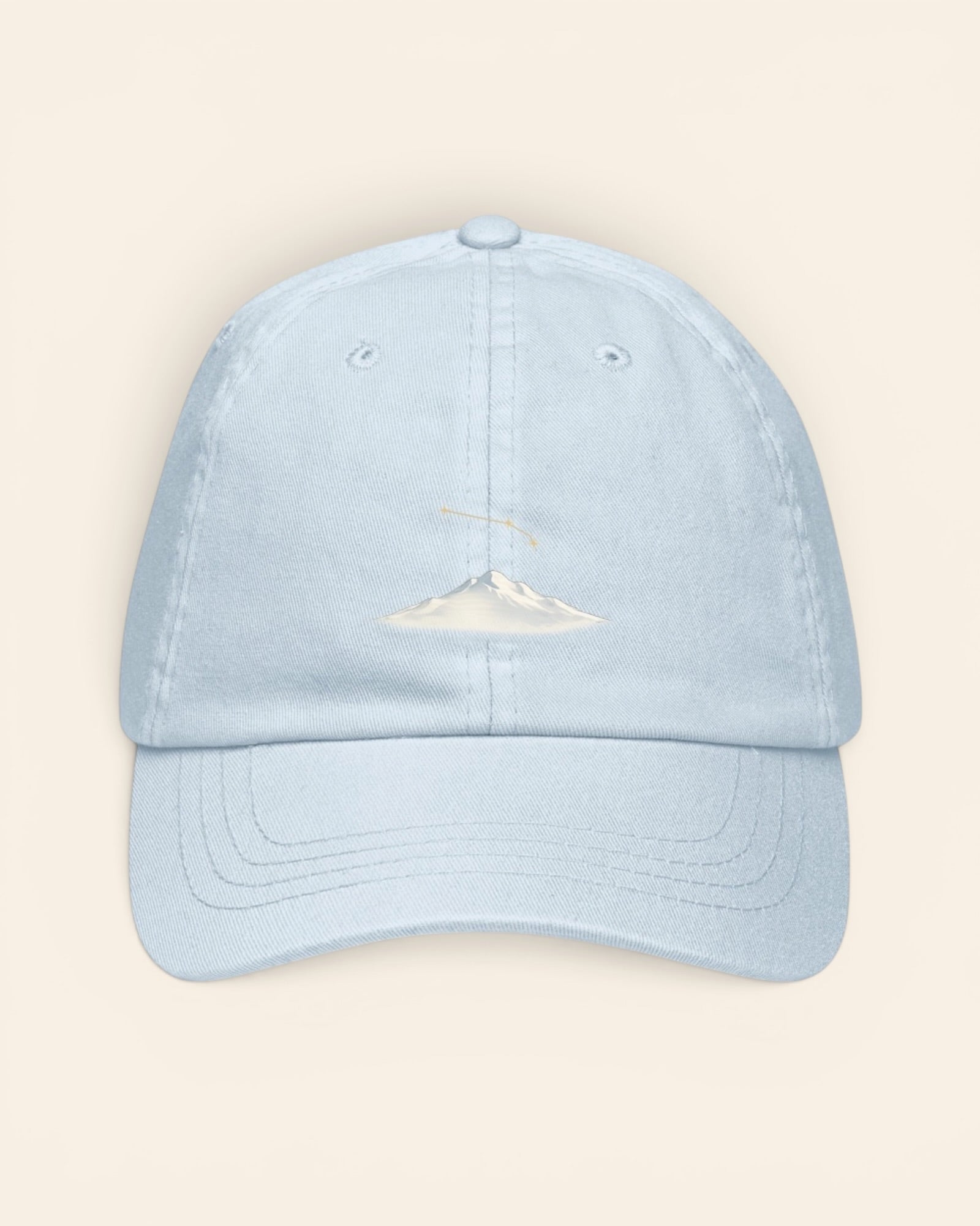 Aries constellation hat with embroidered stars above a mountain ridge, in Pastel Blue