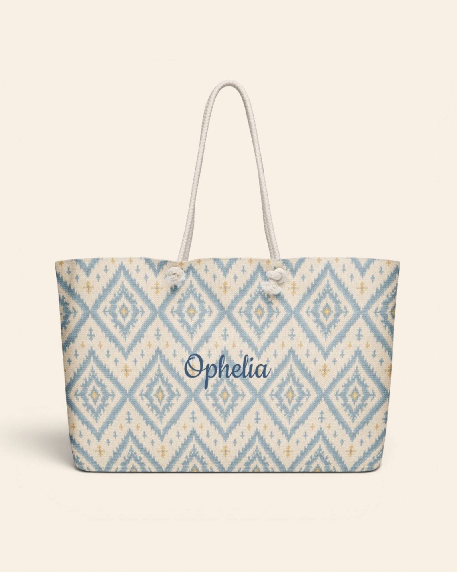 A Place Between The Peaks Weekender Bag, with dusty blue ikat-inspired diamonds and soft golden accents print