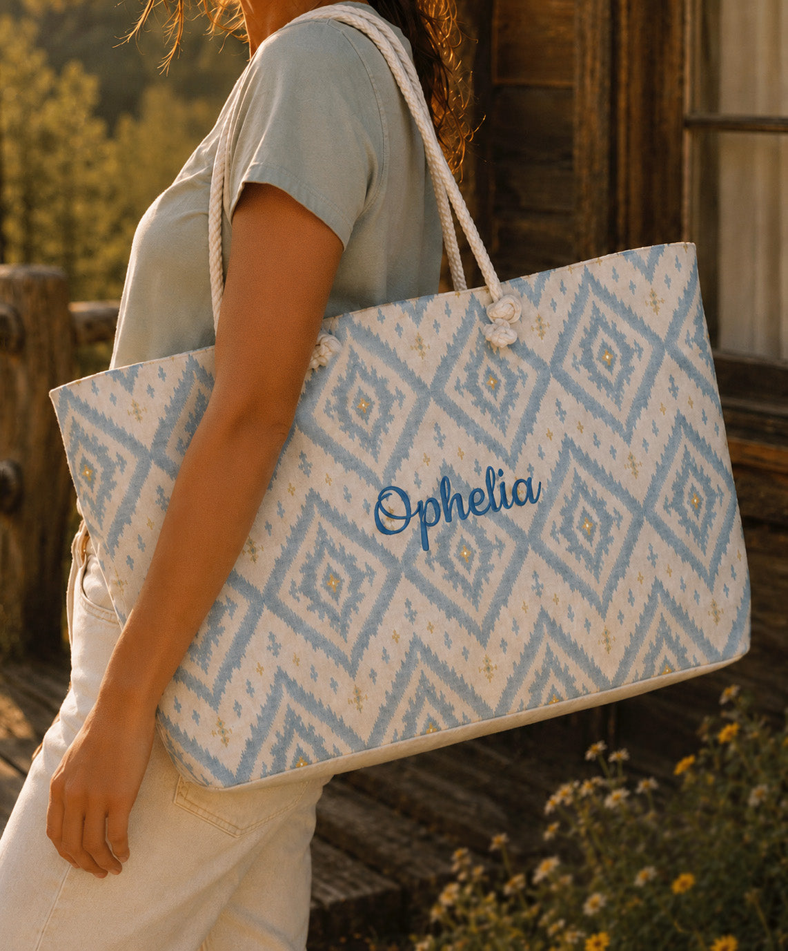 A Place Between The Peaks Weekender Bag, with dusty blue ikat-inspired diamonds and soft golden accents print
