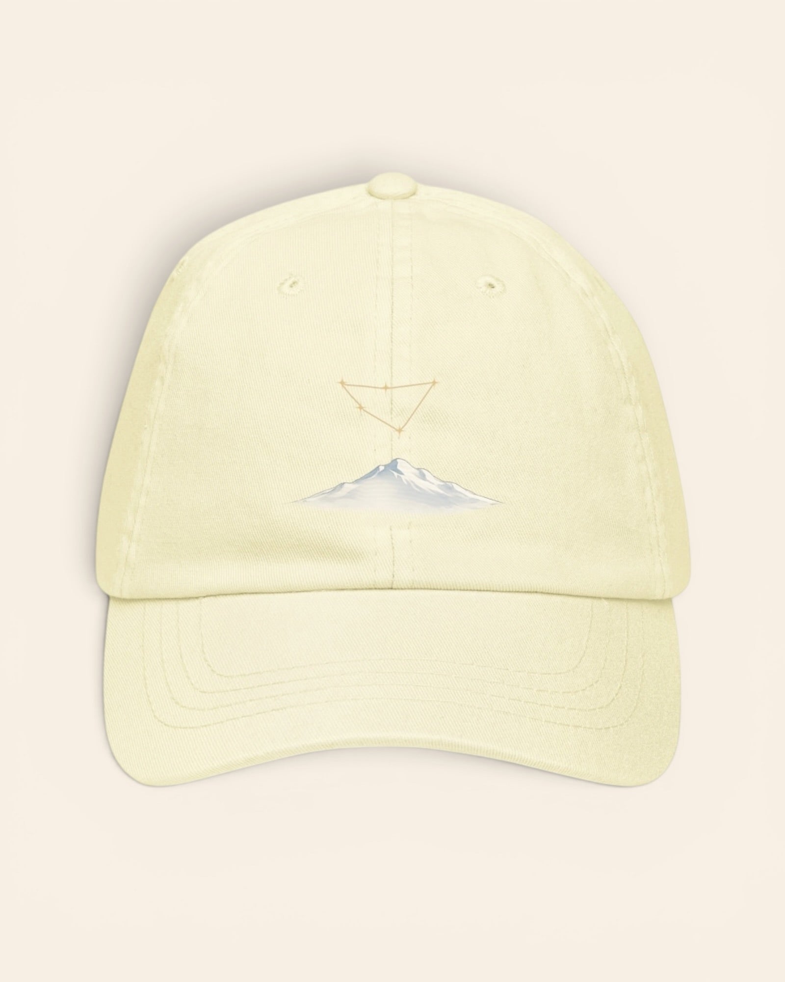Capricorn constellation hat with embroidered stars above a mountain ridge, in Pastel Lemon