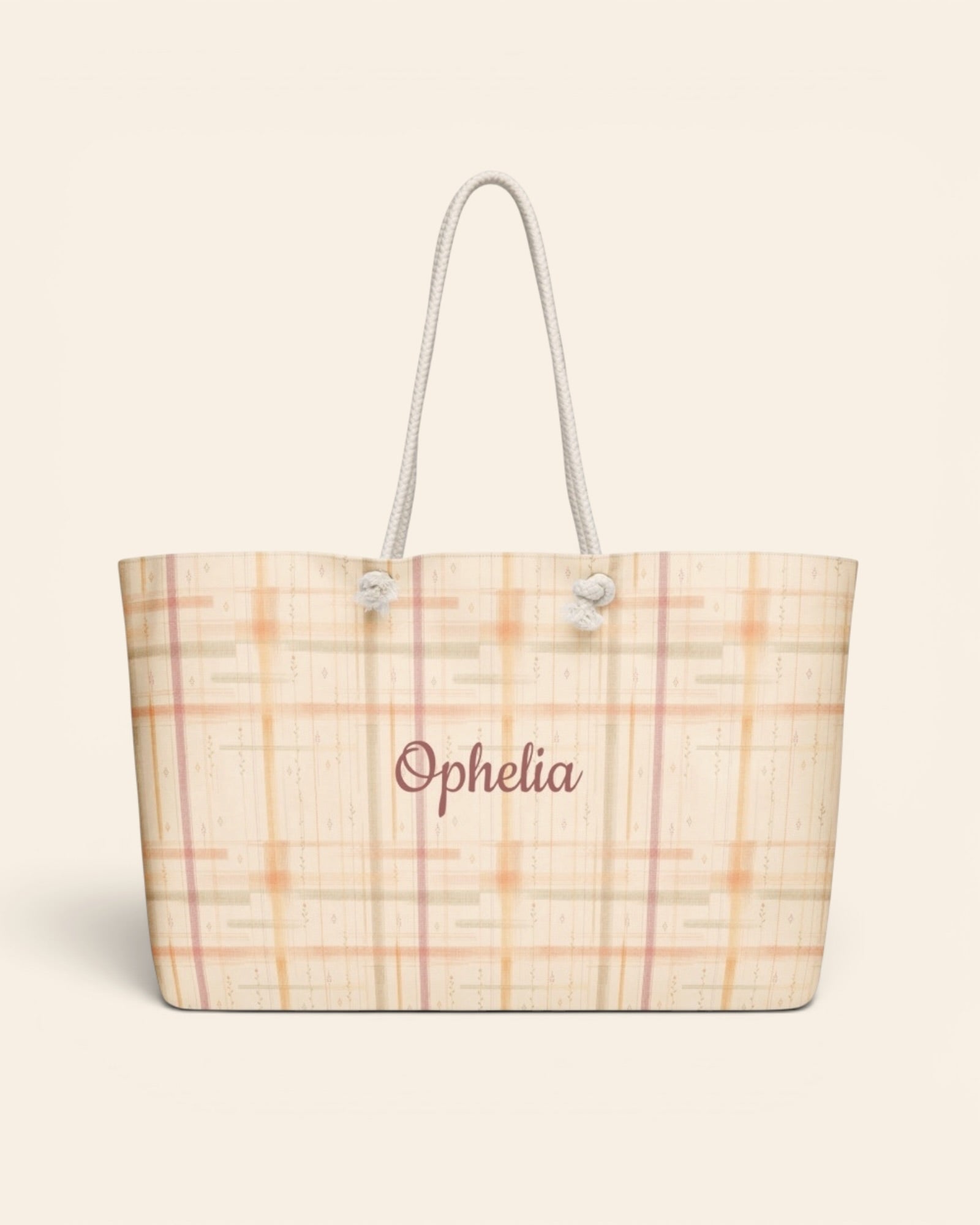 Written By The Wilderness Weekender Bag, with vintage-inspired woven plaid in apricot, sage, and peach print