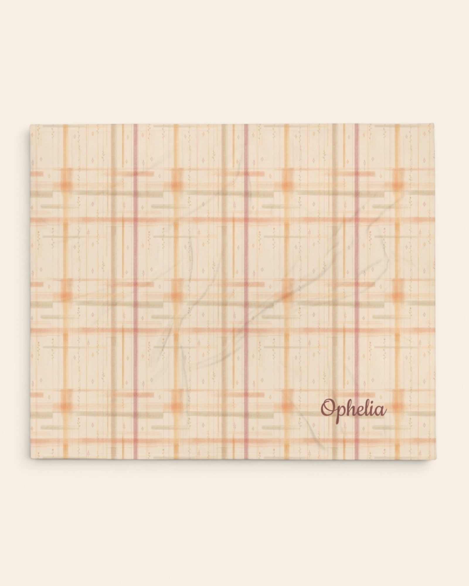 Written By The Wilderness Throw Blanket, with vintage-inspired woven plaid in apricot, sage, and peach print
