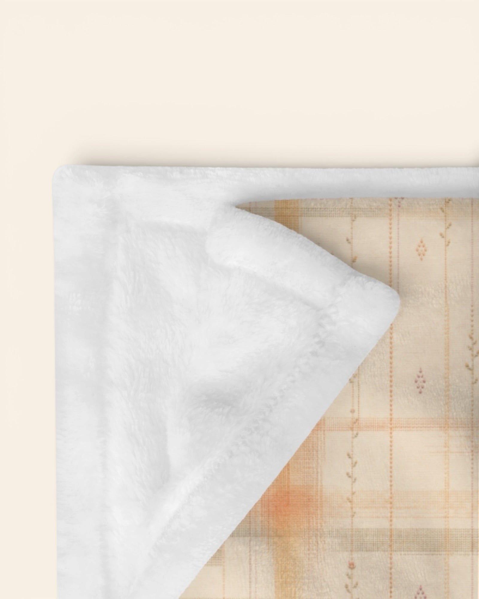 Written By The Wilderness Throw Blanket, with vintage-inspired woven plaid in apricot, sage, and peach print