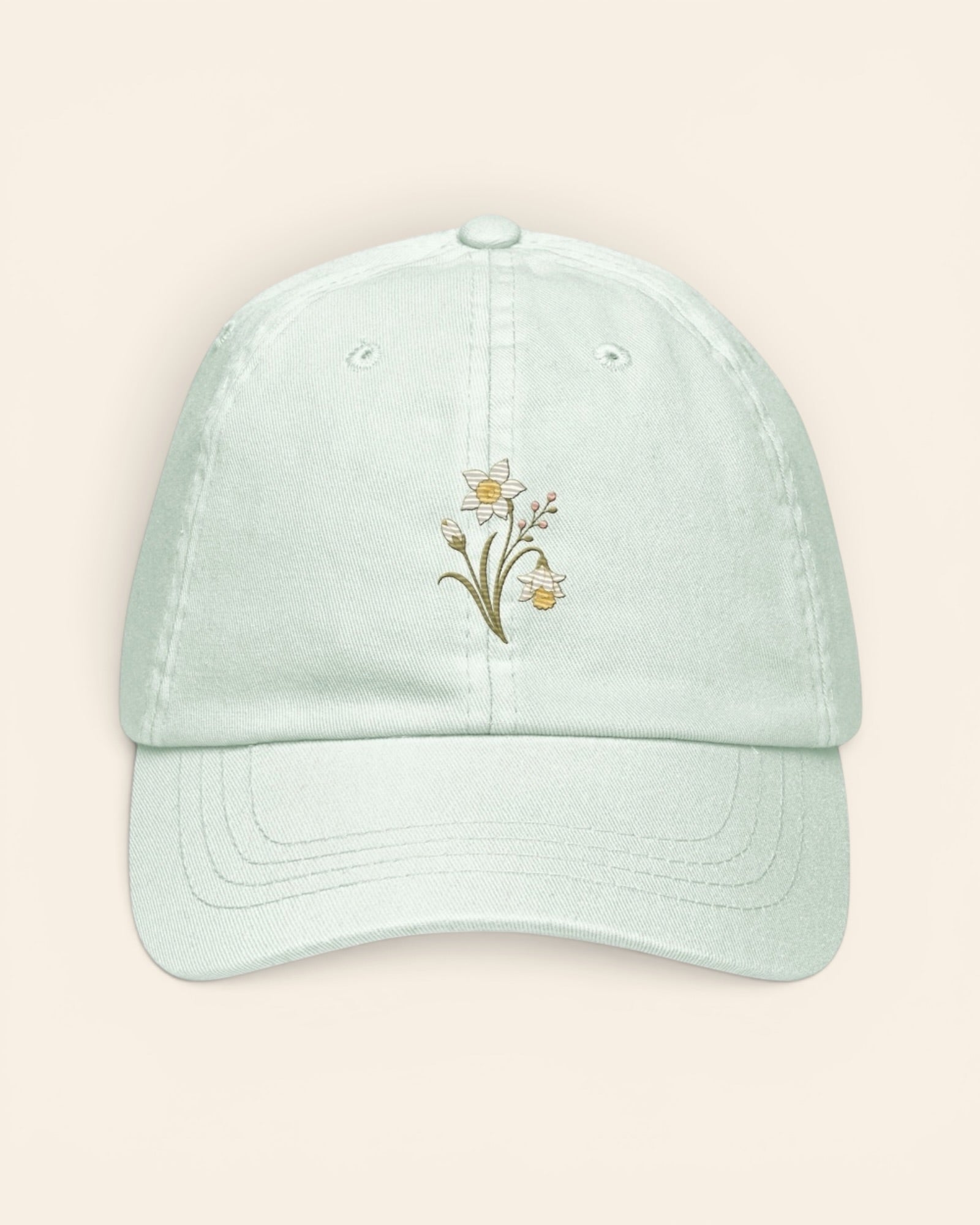 December birth flower hat with embroidered narcissus and holly, in Pastel Mint