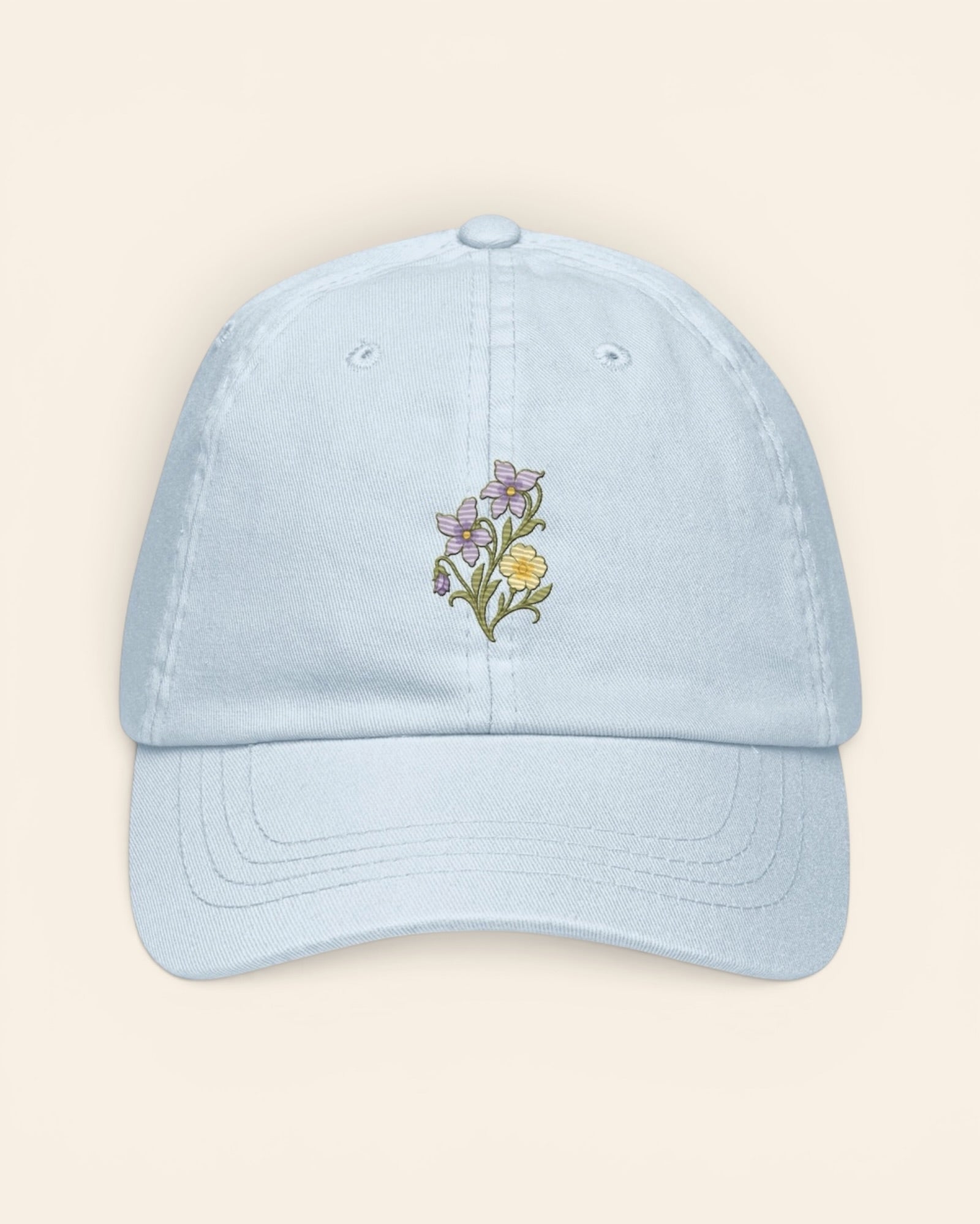 February birth flower hat with embroidered violet and primrose, in Pastel Blue