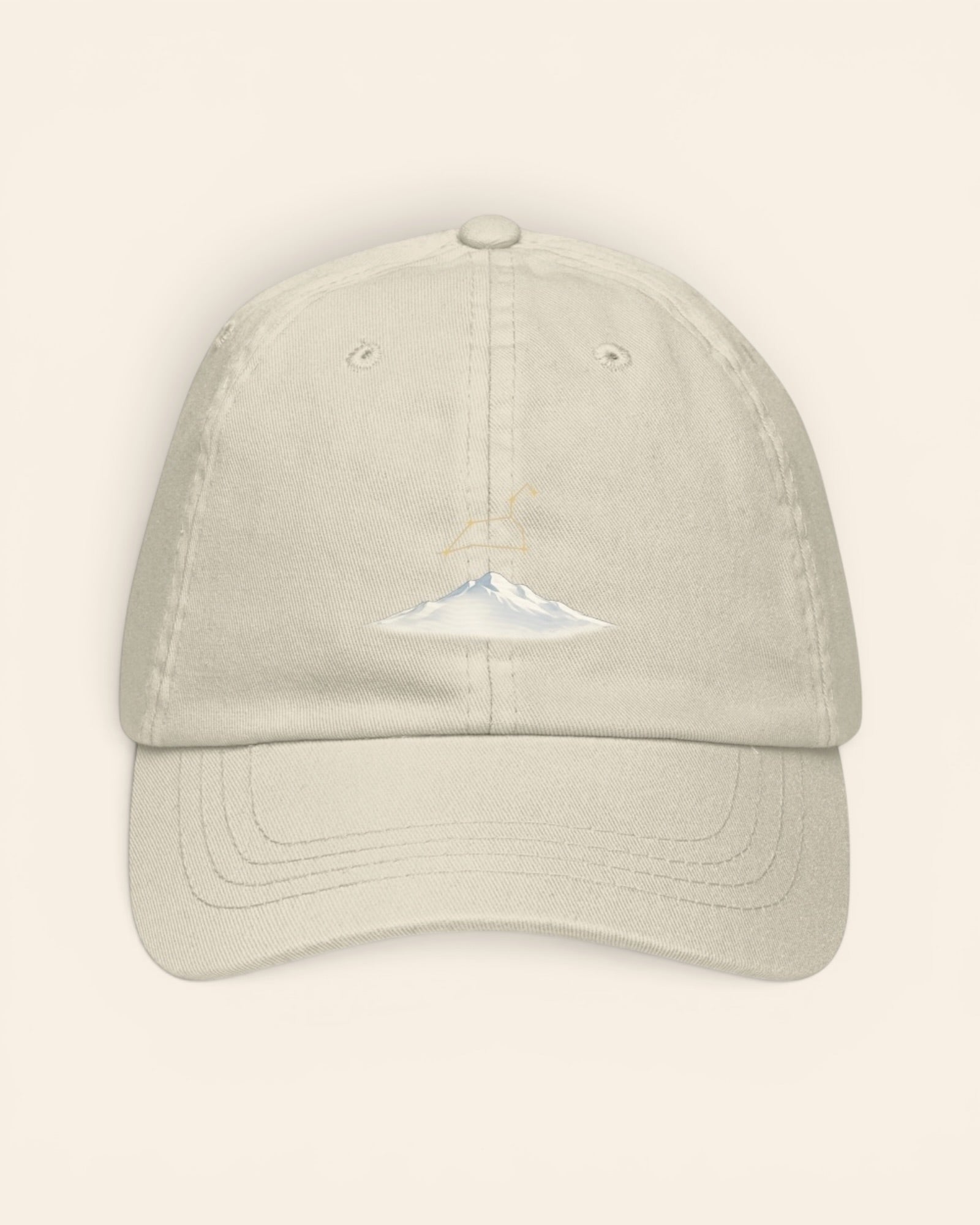 Leo constellation hat with embroidered stars above a mountain ridge, in Beige