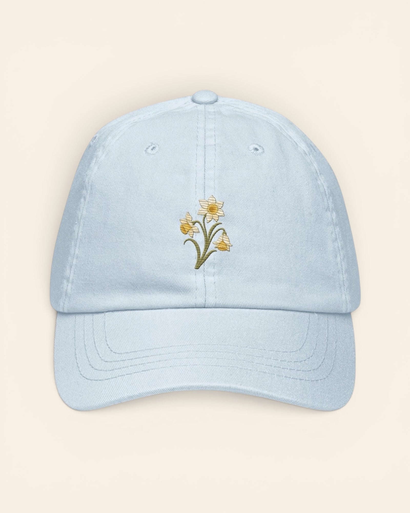 March birth flower hat with embroidered daffodil and jonquil, in Pastel Blue