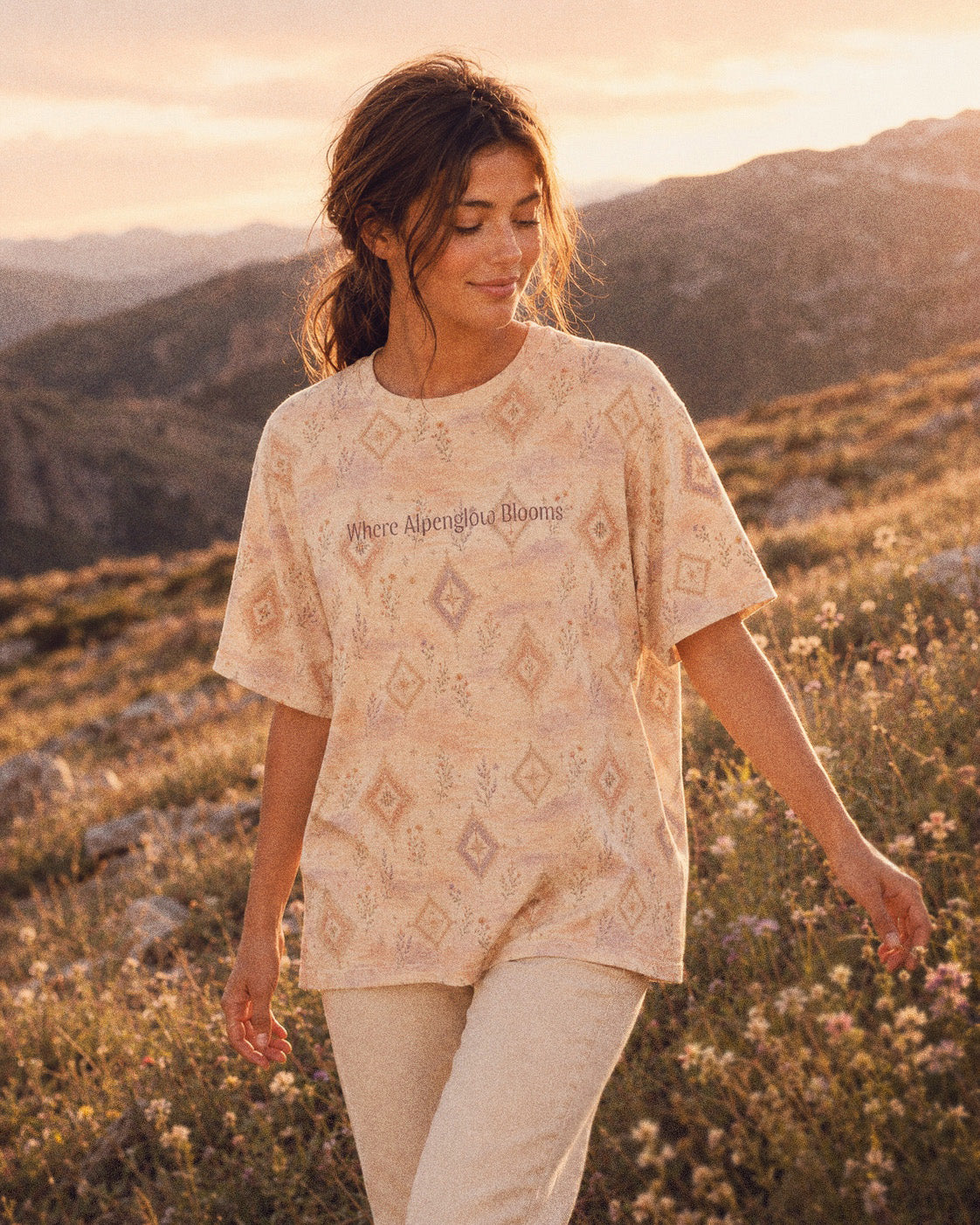 Where Alpenglow Blooms Oversized Tee, with alpenglow-inspired diamonds and alpine wildflower sprigs print