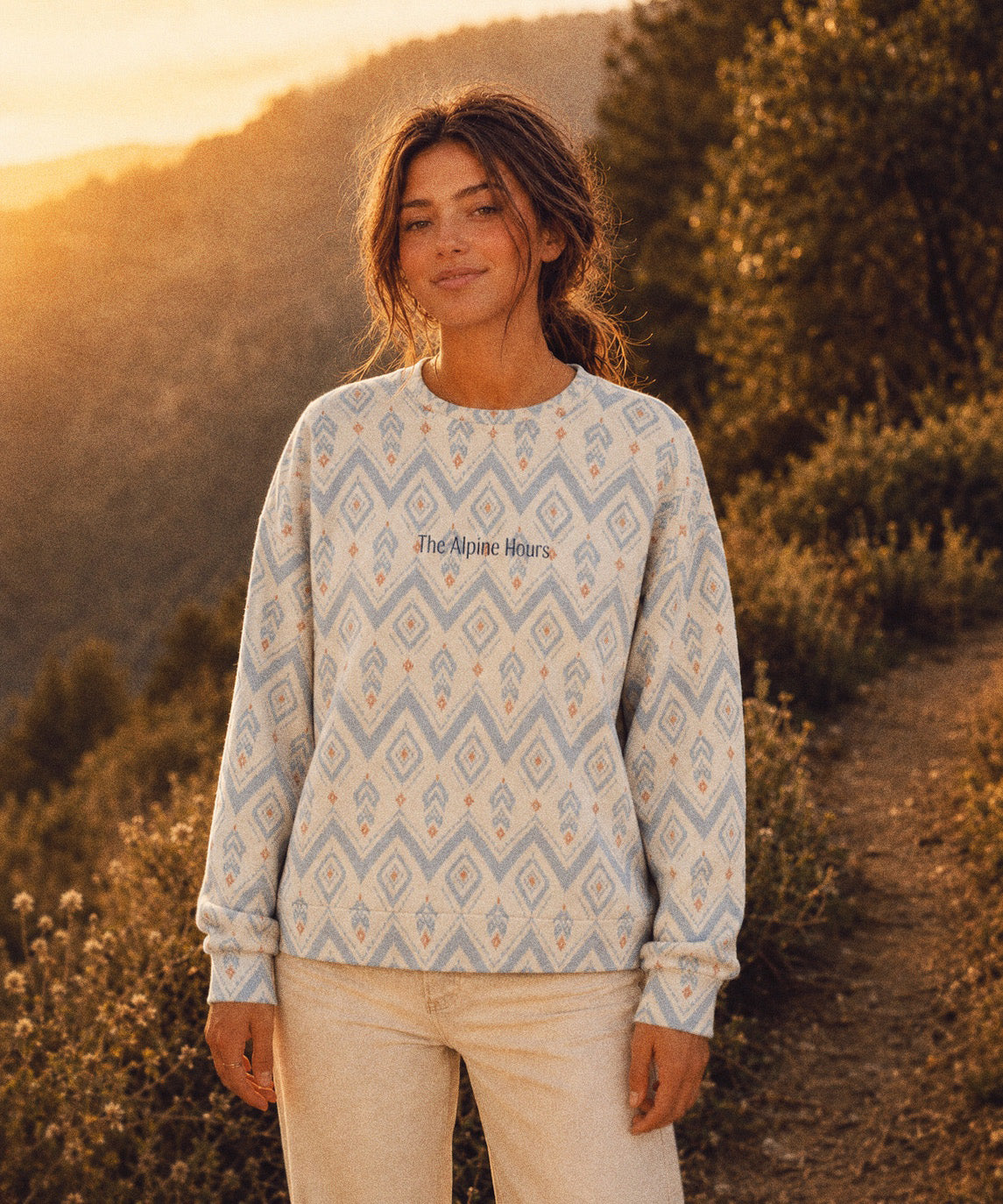 The Alpine Hours Crewneck Sweatshirt, with mountain-inspired diamonds and rust accents print