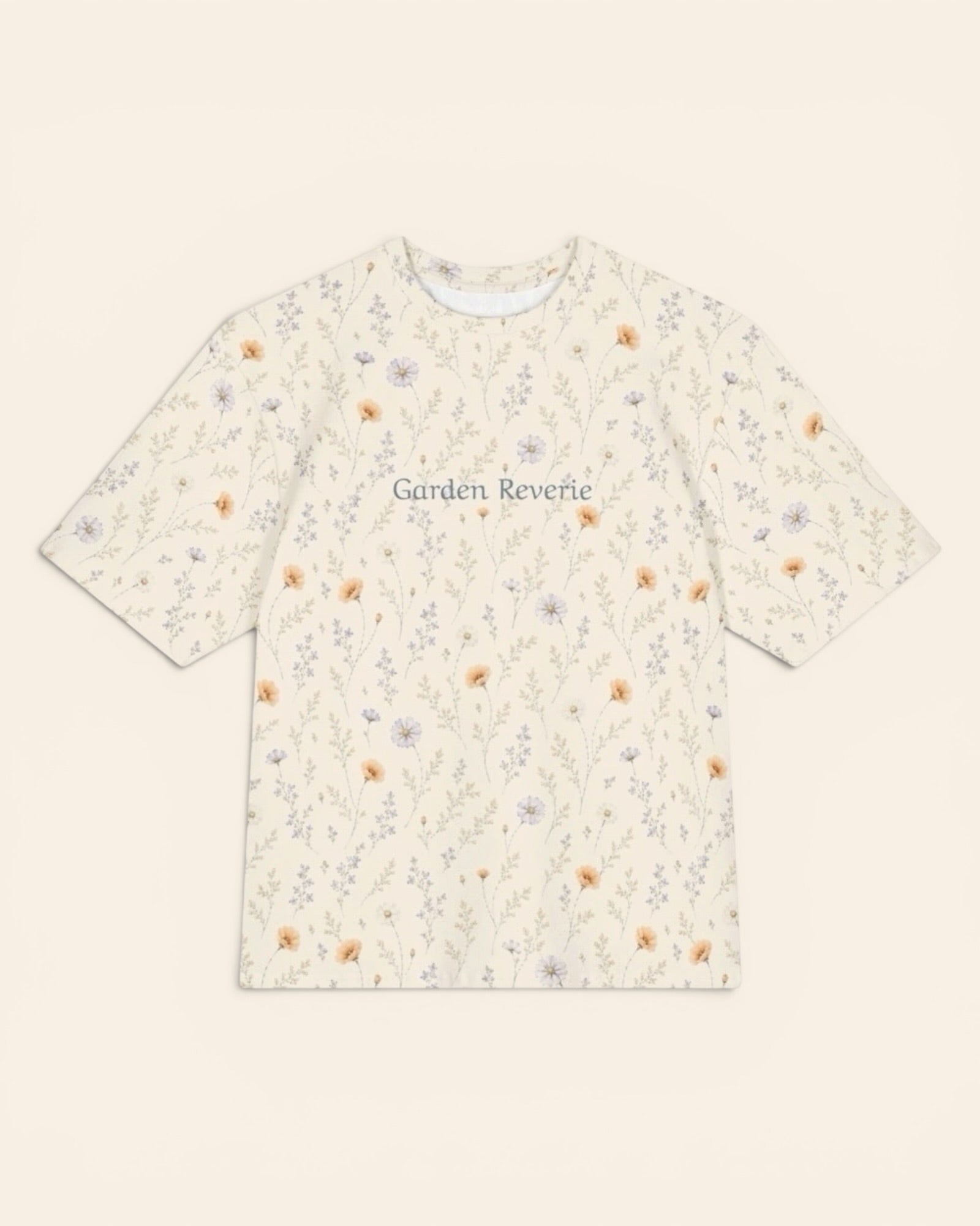 Garden Reverie Oversized Tee, with peach poppies, blue cosmos, forget-me-nots, and daisies print