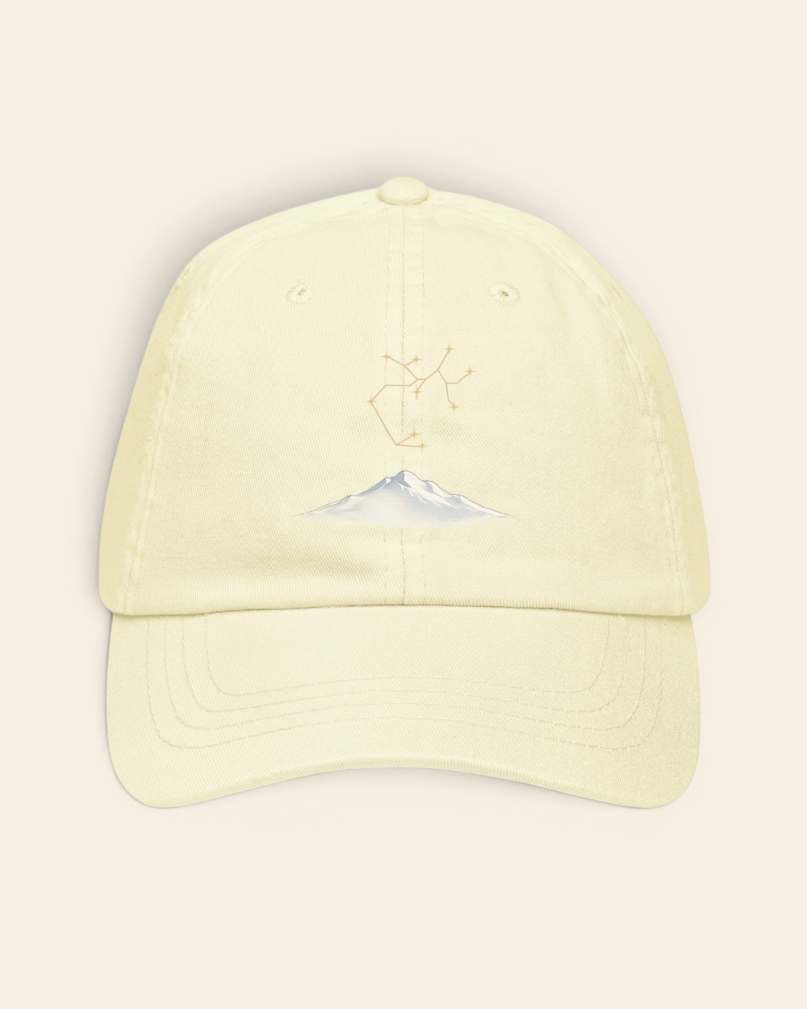 Sagittarius constellation hat with embroidered stars above a mountain ridge, in Pastel Lemon