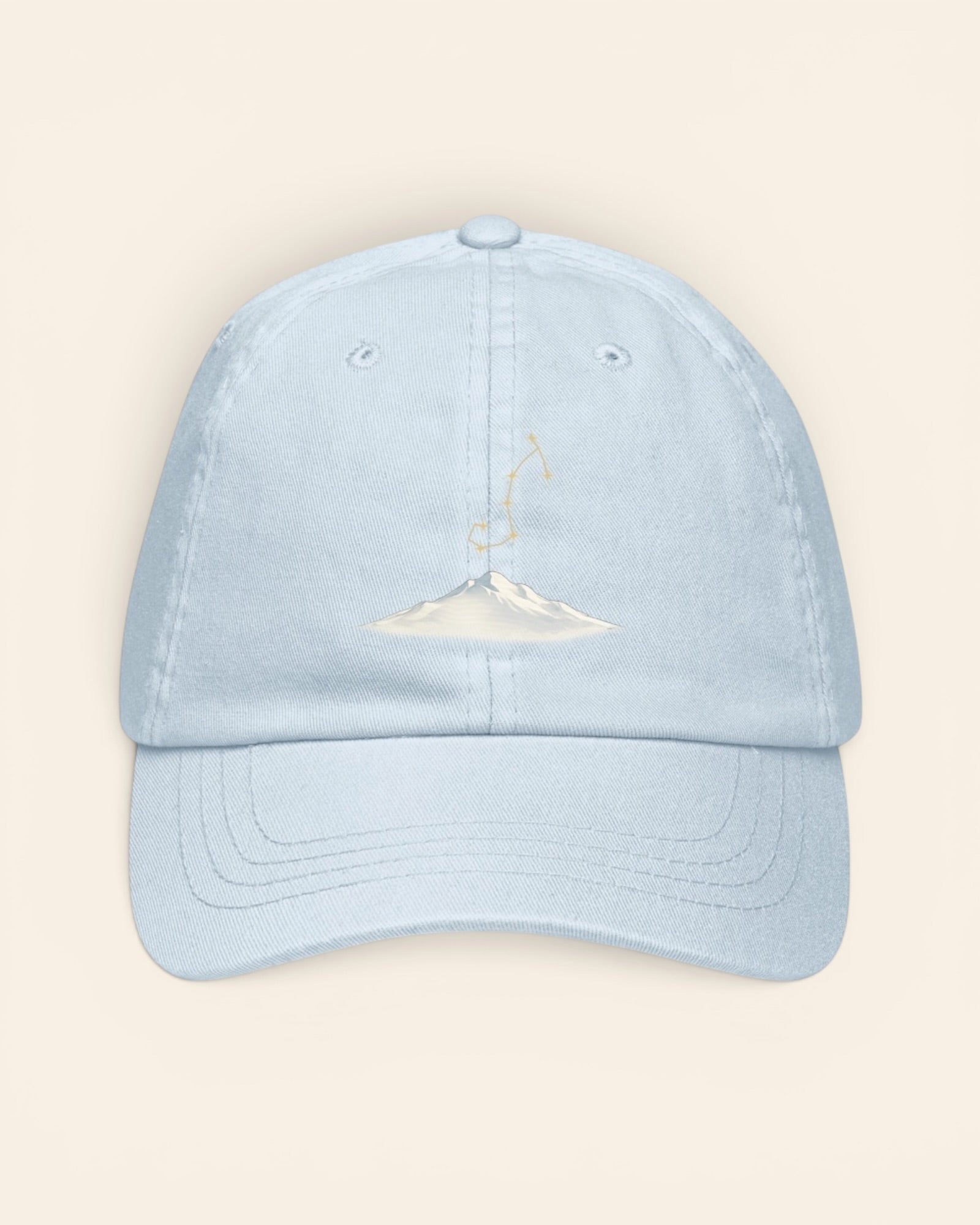Scorpio constellation hat with embroidered stars above a mountain ridge, in Pastel Blue
