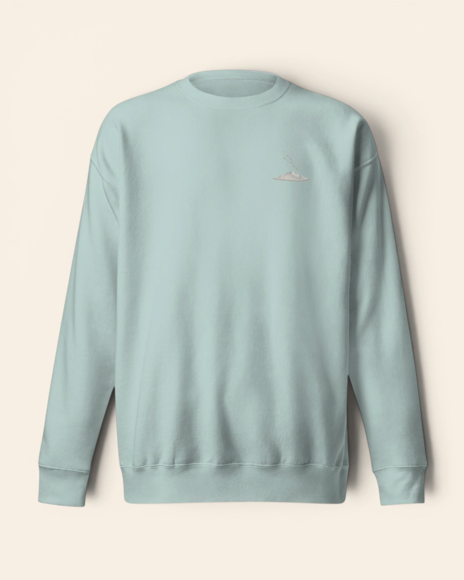 Taurus constellation crewneck sweatshirt with embroidered stars above a mountain ridge