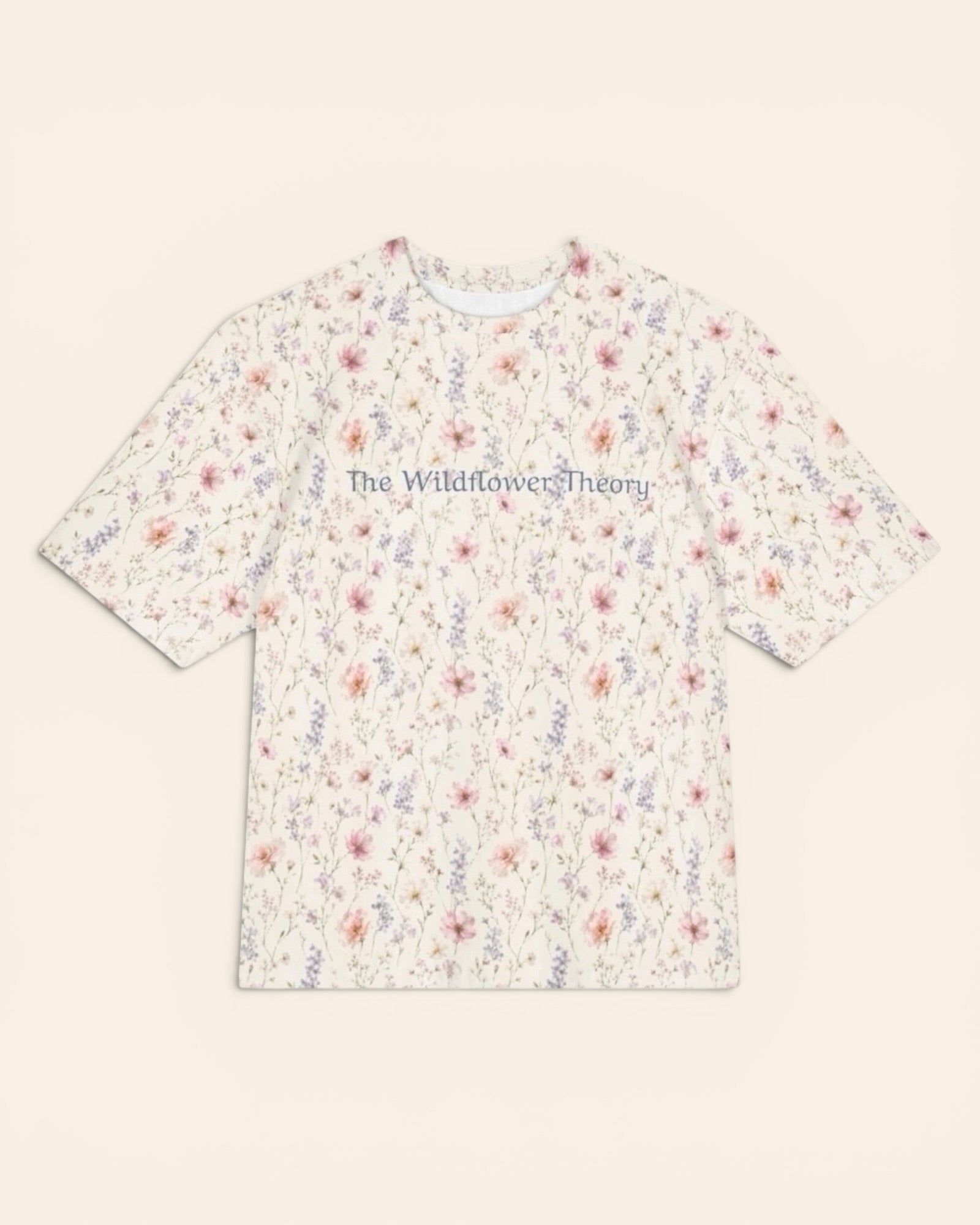 The Wildflower Theory Oversized Tee, with blush cosmos, cottage roses, larkspur, and baby's breath print