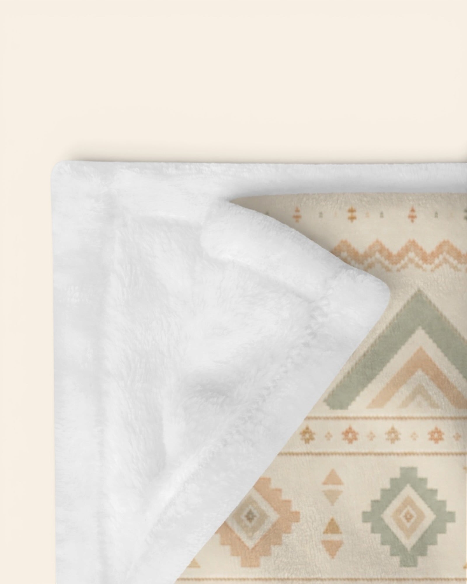 Where The Mountains Wait Throw Blanket, with mountain-inspired geometric bands in sage, sand, and peach print