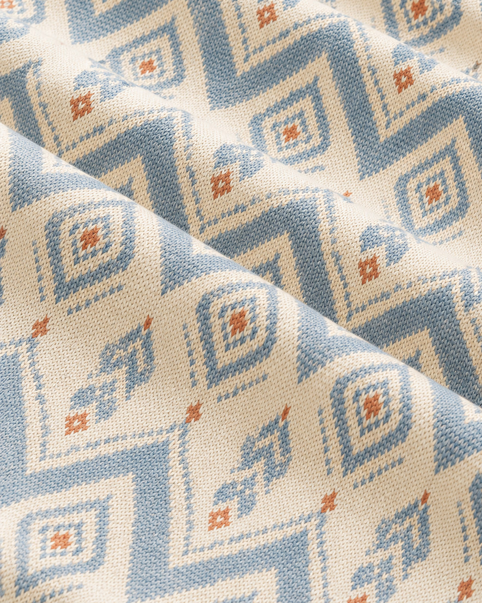 The Alpine Hours Oversized Tee, with mountain-inspired diamonds and rust accents print