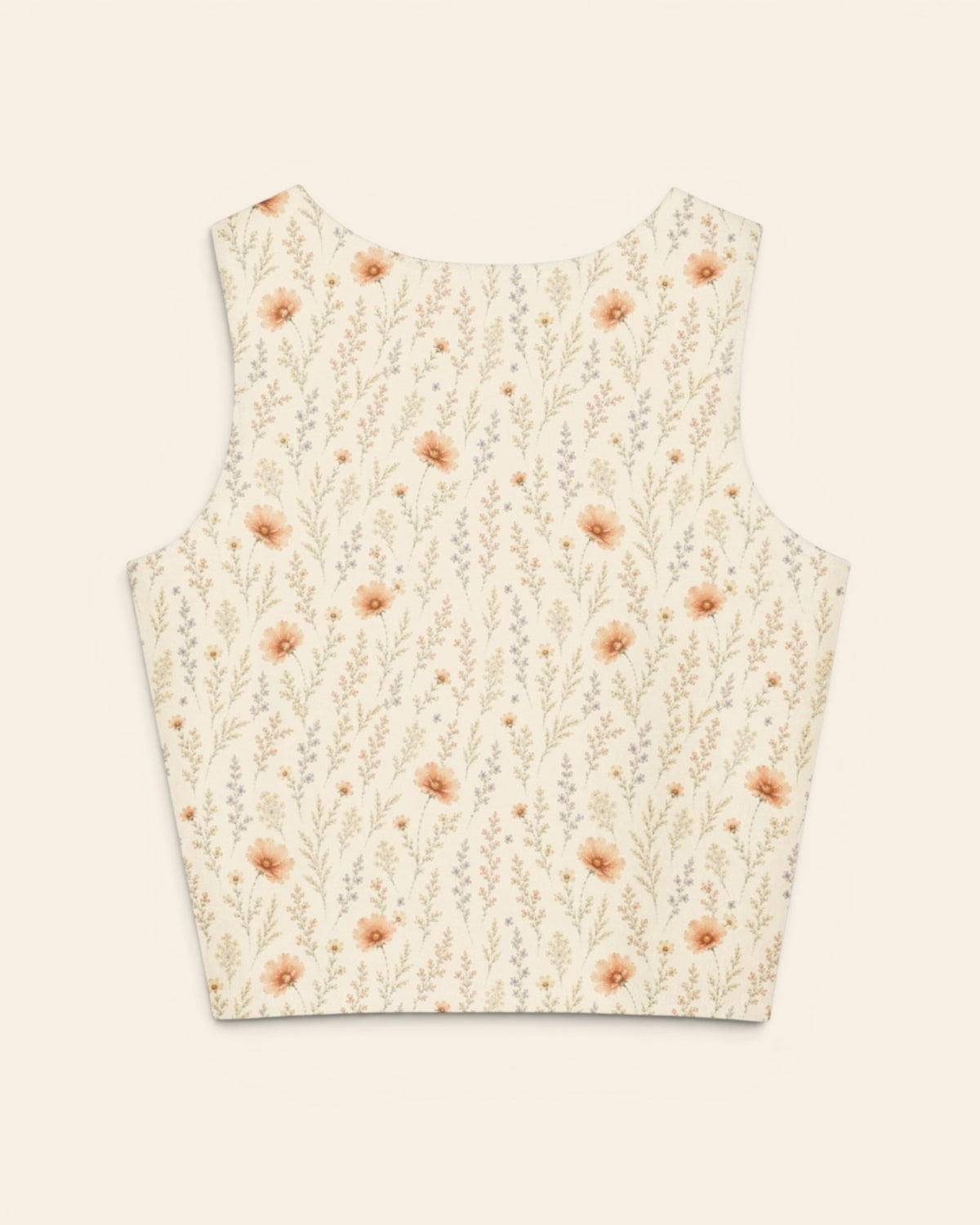 The same crop tank shown from the back on a plain cream background, with no text, so the print runs unbroken across the panel. It is warm cream, printed with apricot cosmos blooms among fine sage stems.