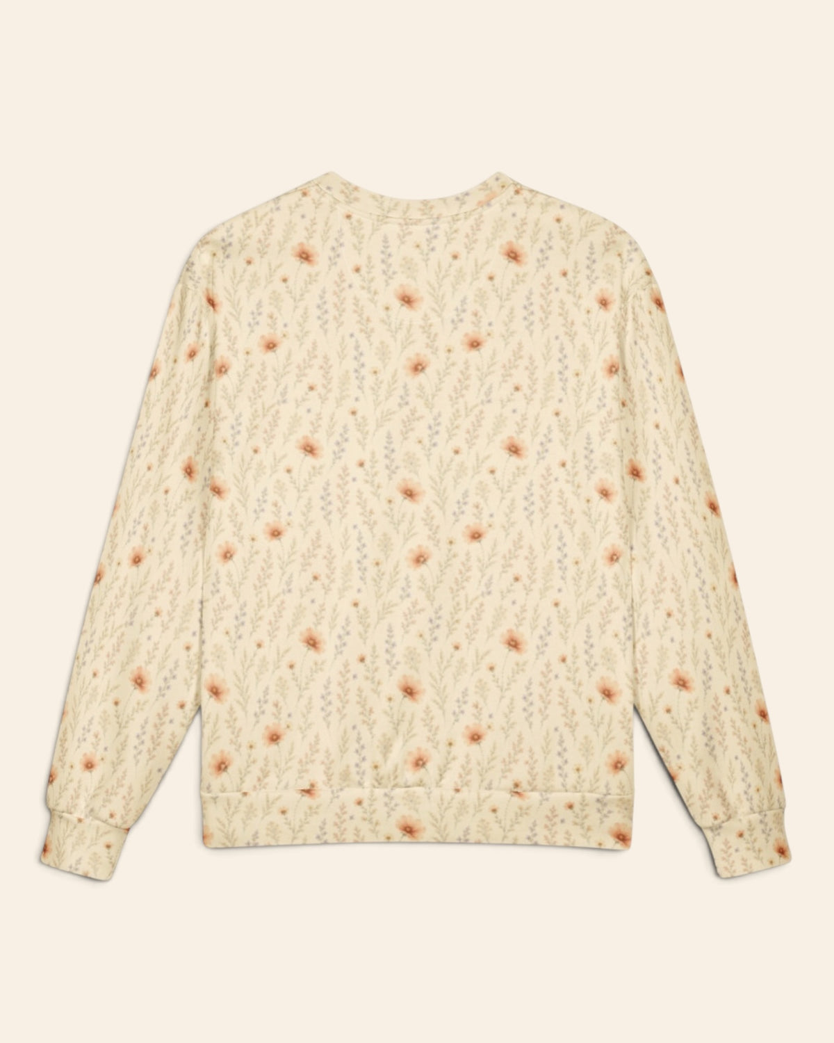 The same crewneck shown flat from the back on a plain cream background, with no text, so the all-over print runs unbroken across the body and sleeves. It is warm cream, printed with apricot cosmos blooms among fine sage stems.