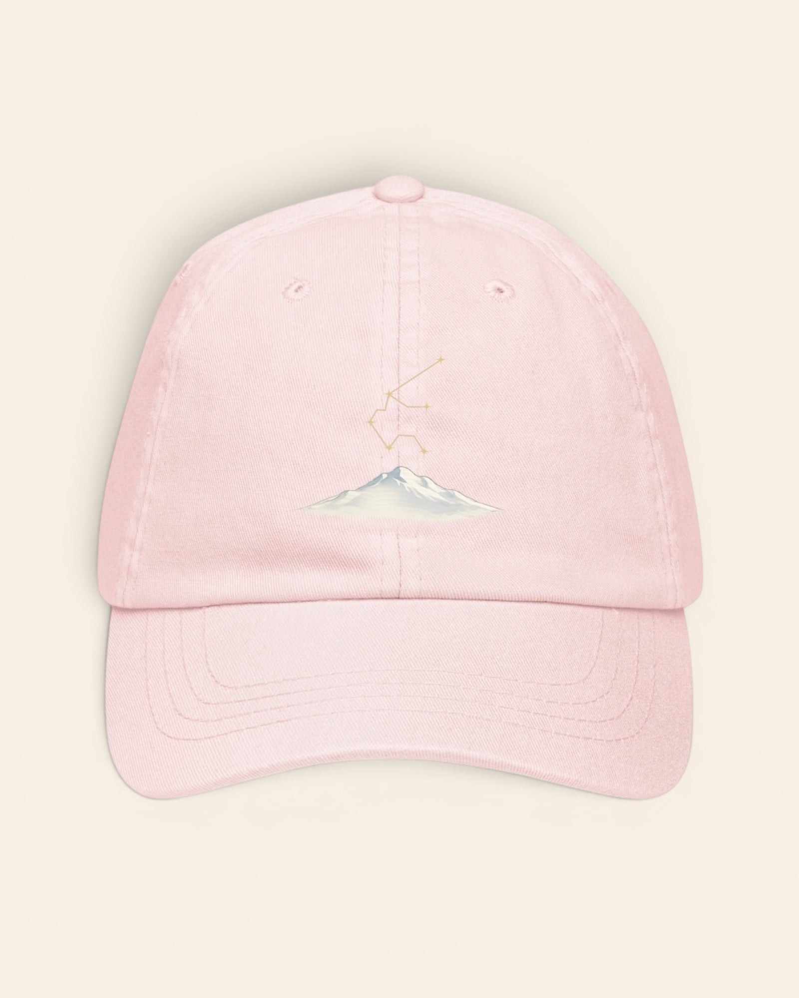 Aquarius constellation hat with embroidered stars above a mountain ridge, in Pastel Pink