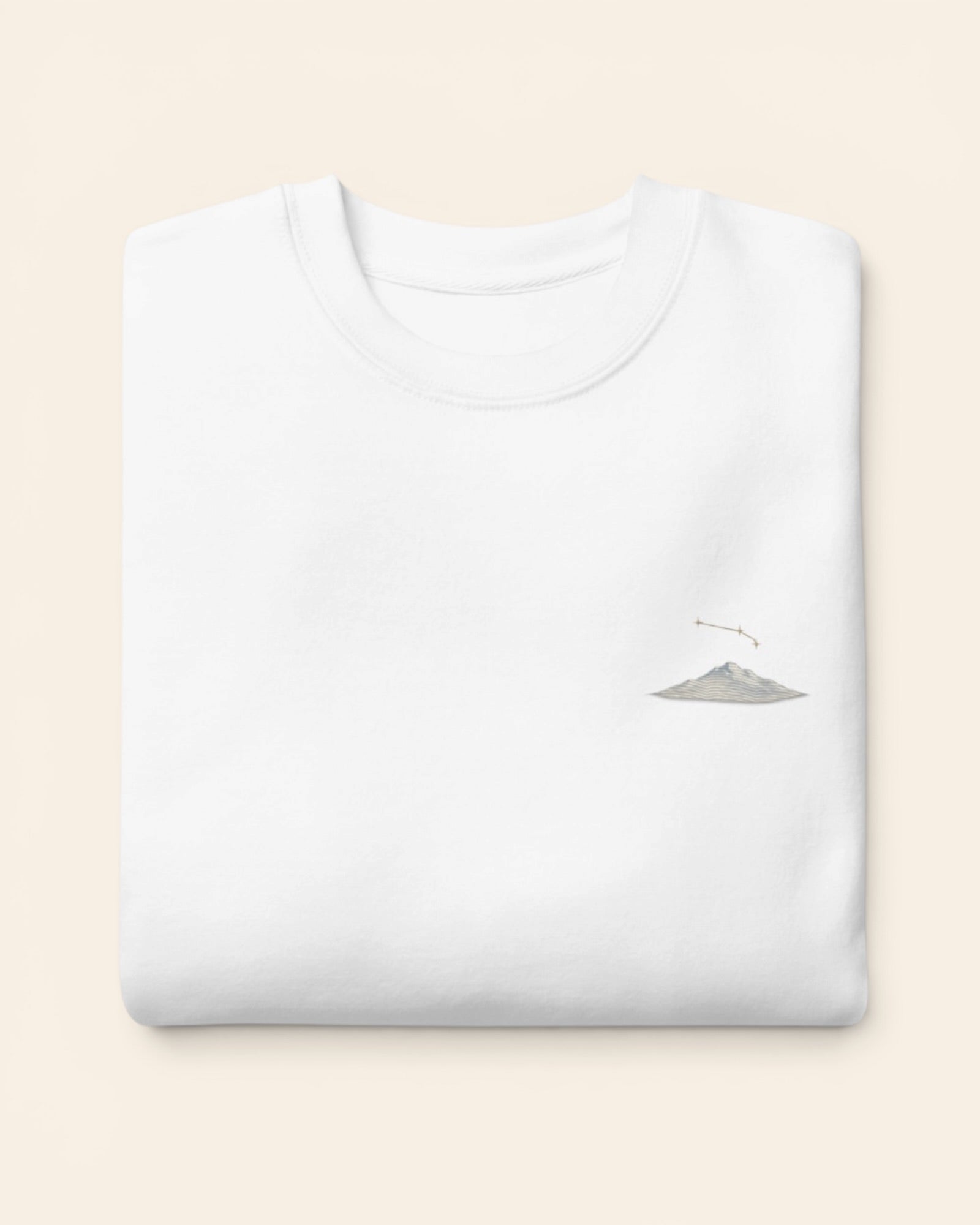 Aries constellation crewneck sweatshirt with embroidered stars above a mountain ridge, in White
