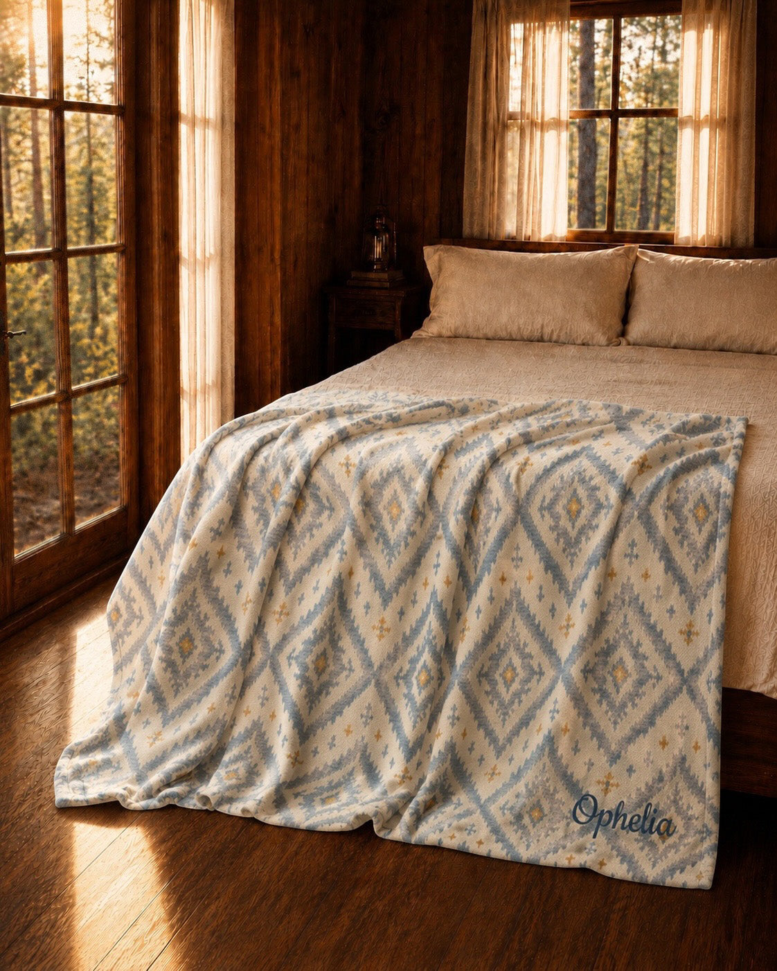 A Place Between The Peaks Throw Blanket, with dusty blue ikat-inspired diamonds and soft golden accents print