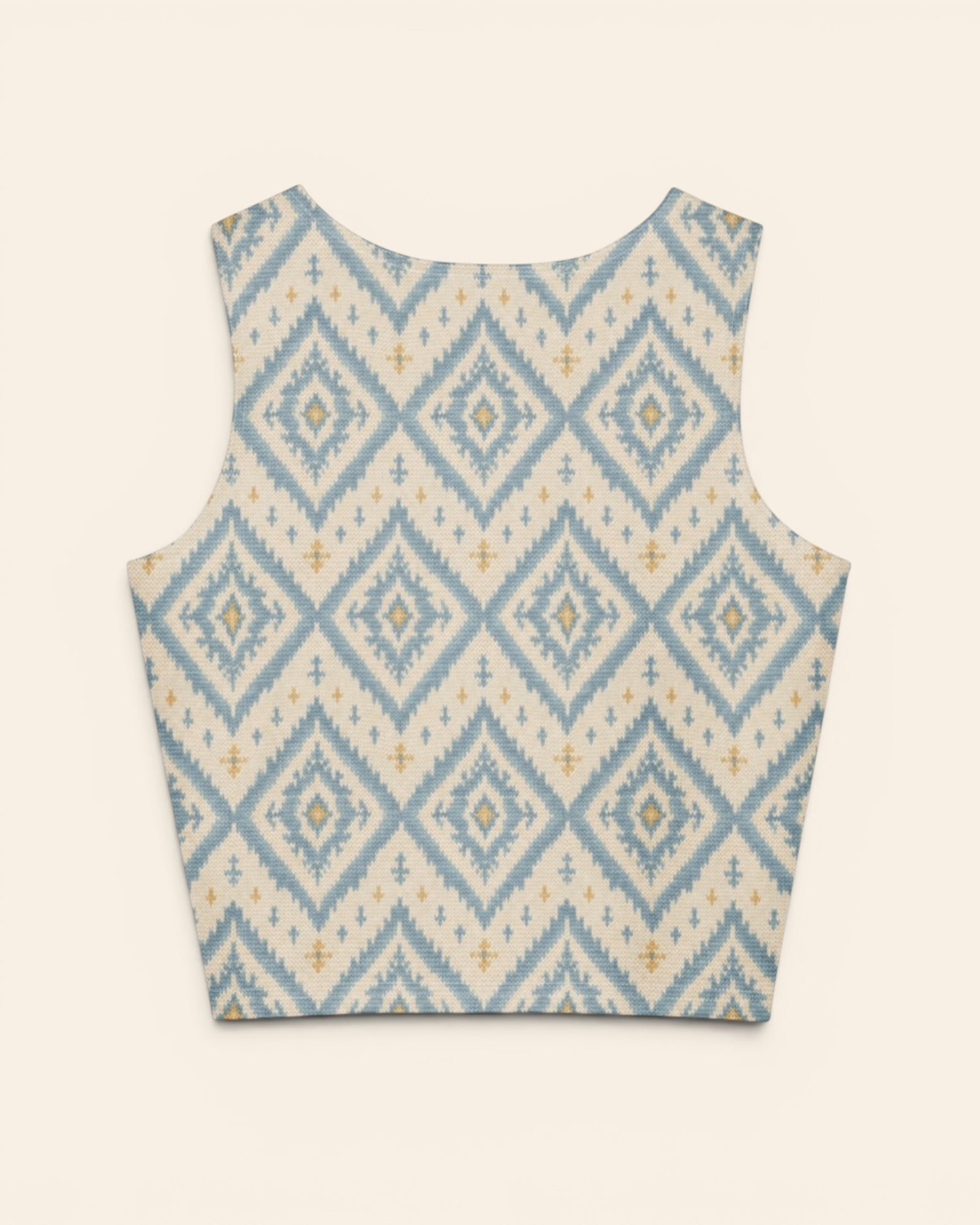 A Place Between The Peaks Crop Top, with dusty blue ikat-inspired diamonds and soft golden accents print