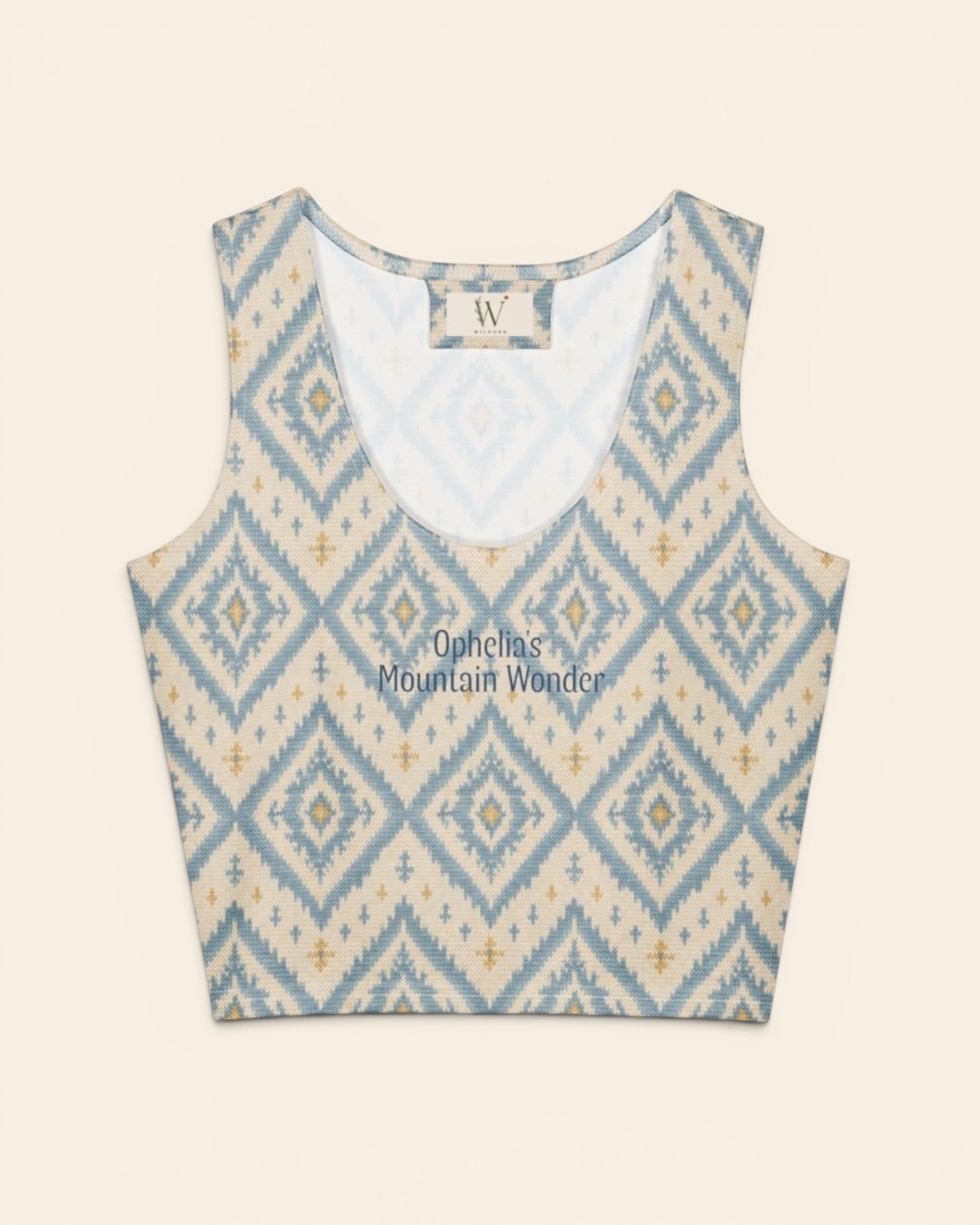 A Place Between The Peaks Crop Top, with dusty blue ikat-inspired diamonds and soft golden accents print