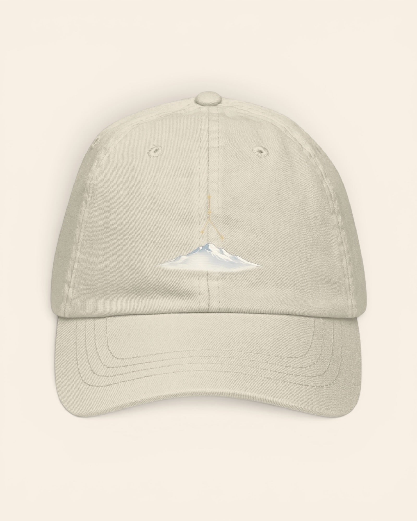 Cancer constellation hat with embroidered stars above a mountain ridge, in Beige