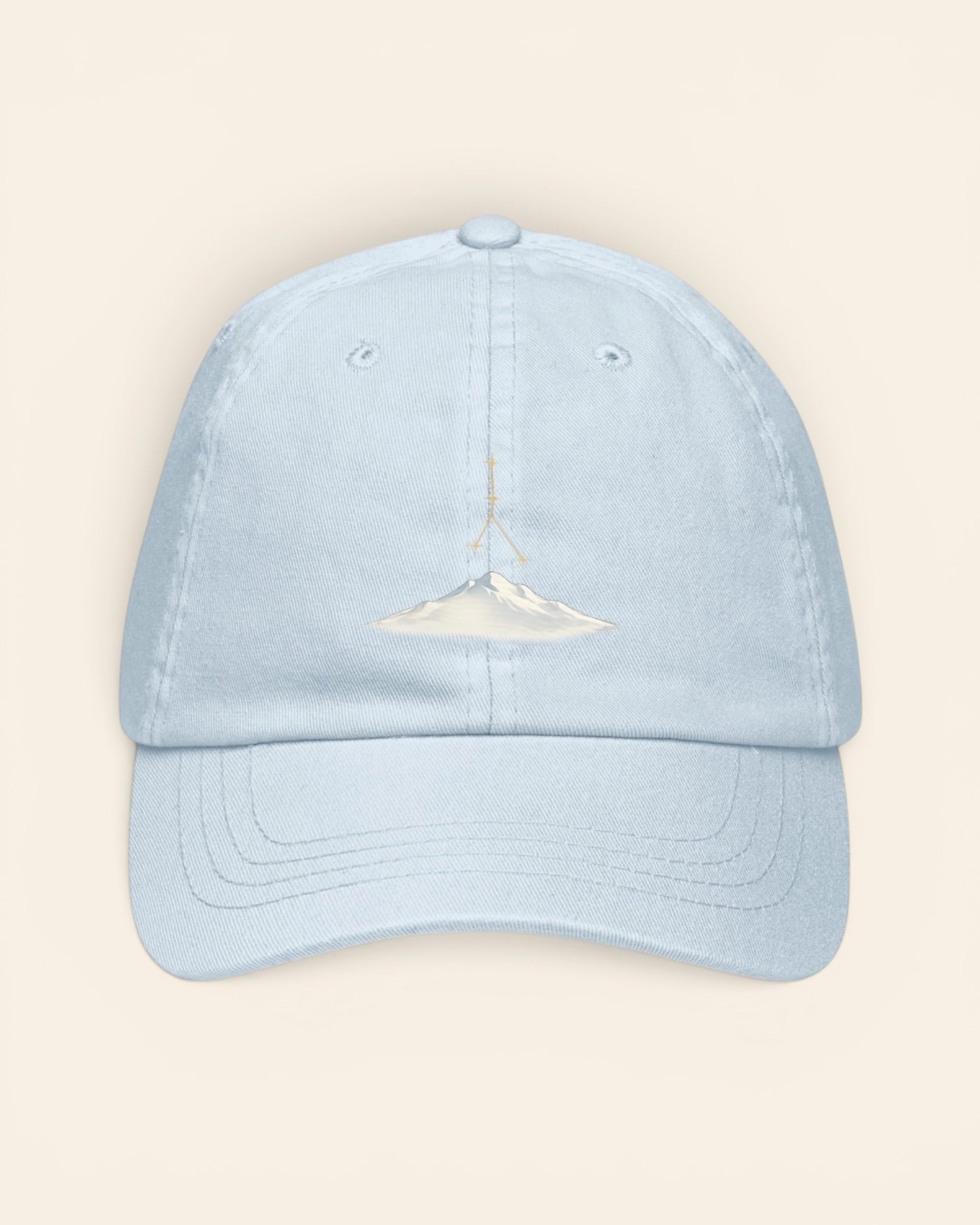 Cancer constellation hat with embroidered stars above a mountain ridge, in Pastel Blue
