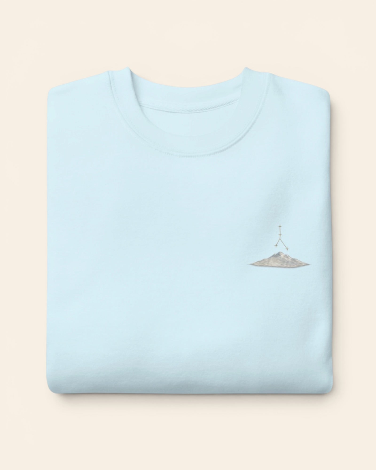 Cancer constellation crewneck sweatshirt with embroidered stars above a mountain ridge, in Sky Blue