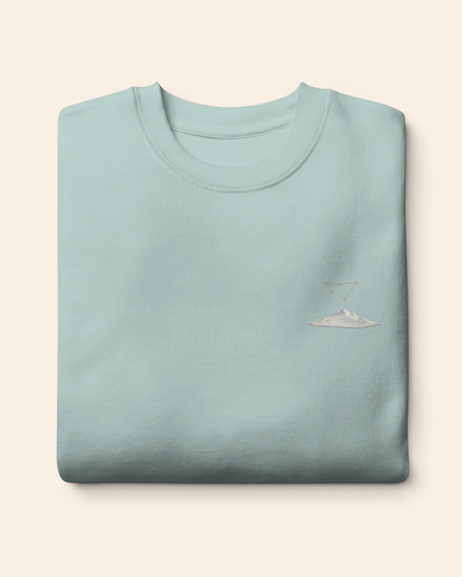 Capricorn constellation crewneck sweatshirt with embroidered stars above a mountain ridge