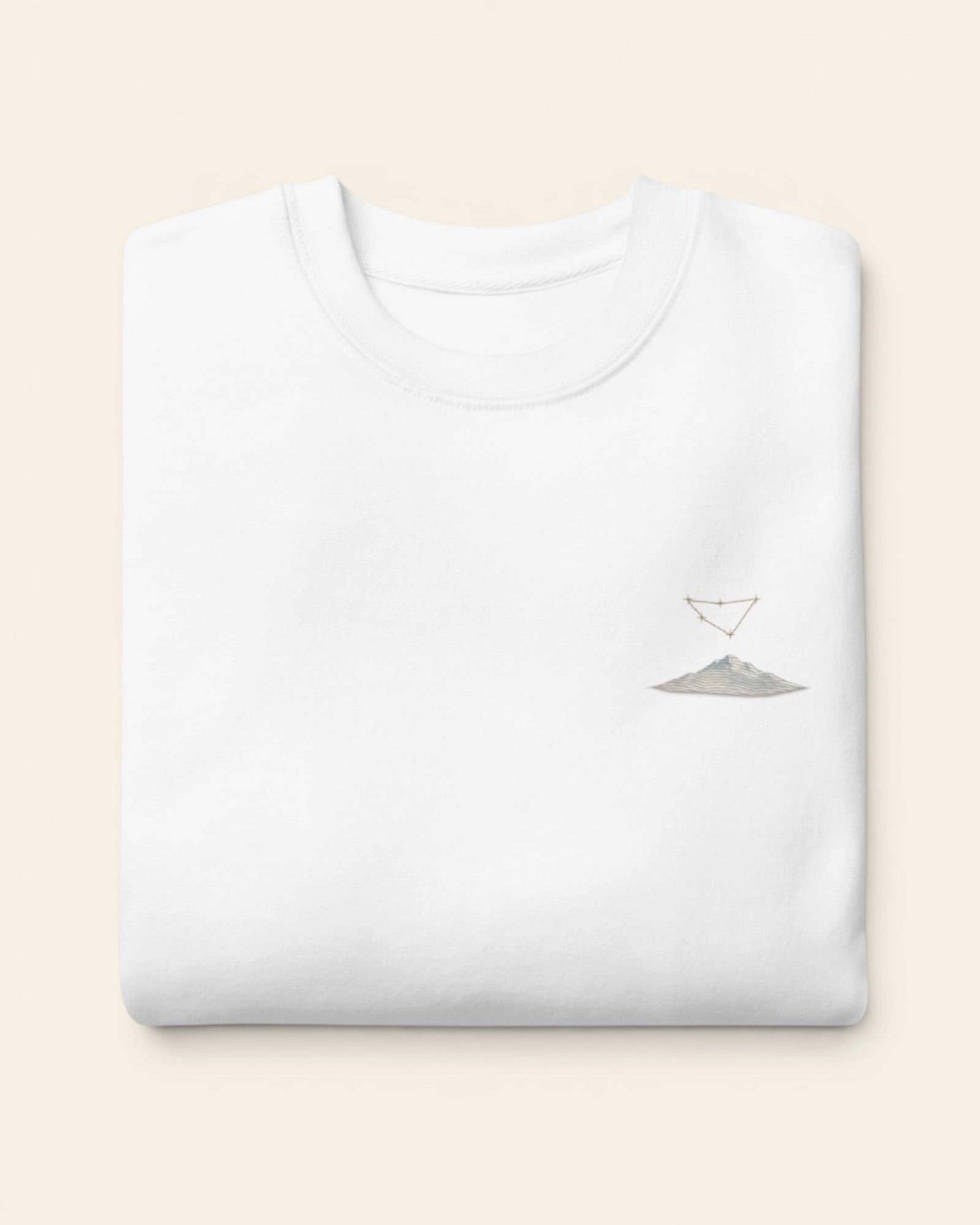 Capricorn constellation crewneck sweatshirt with embroidered stars above a mountain ridge, in White