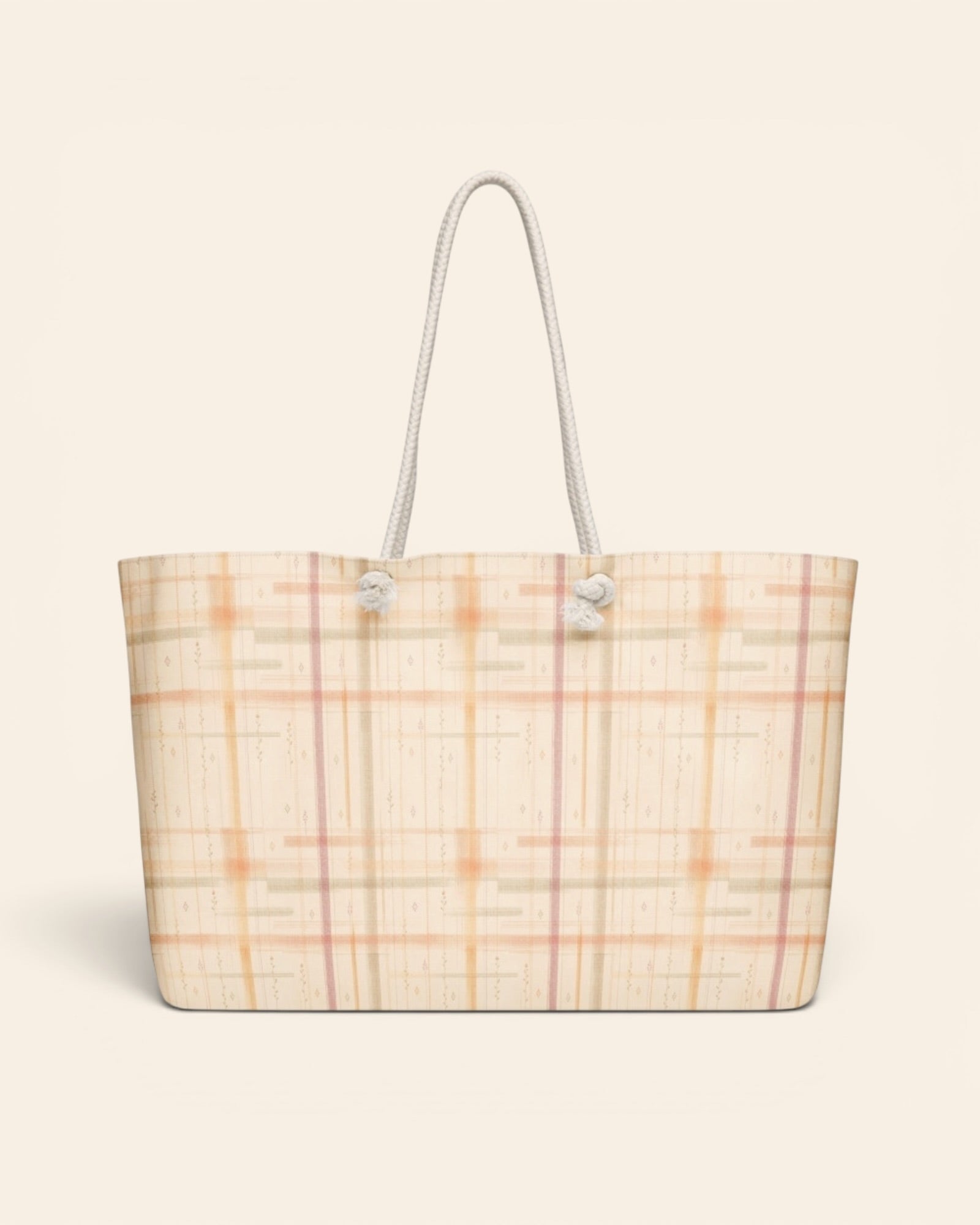 Written By The Wilderness Weekender Bag, with vintage-inspired woven plaid in apricot, sage, and peach print