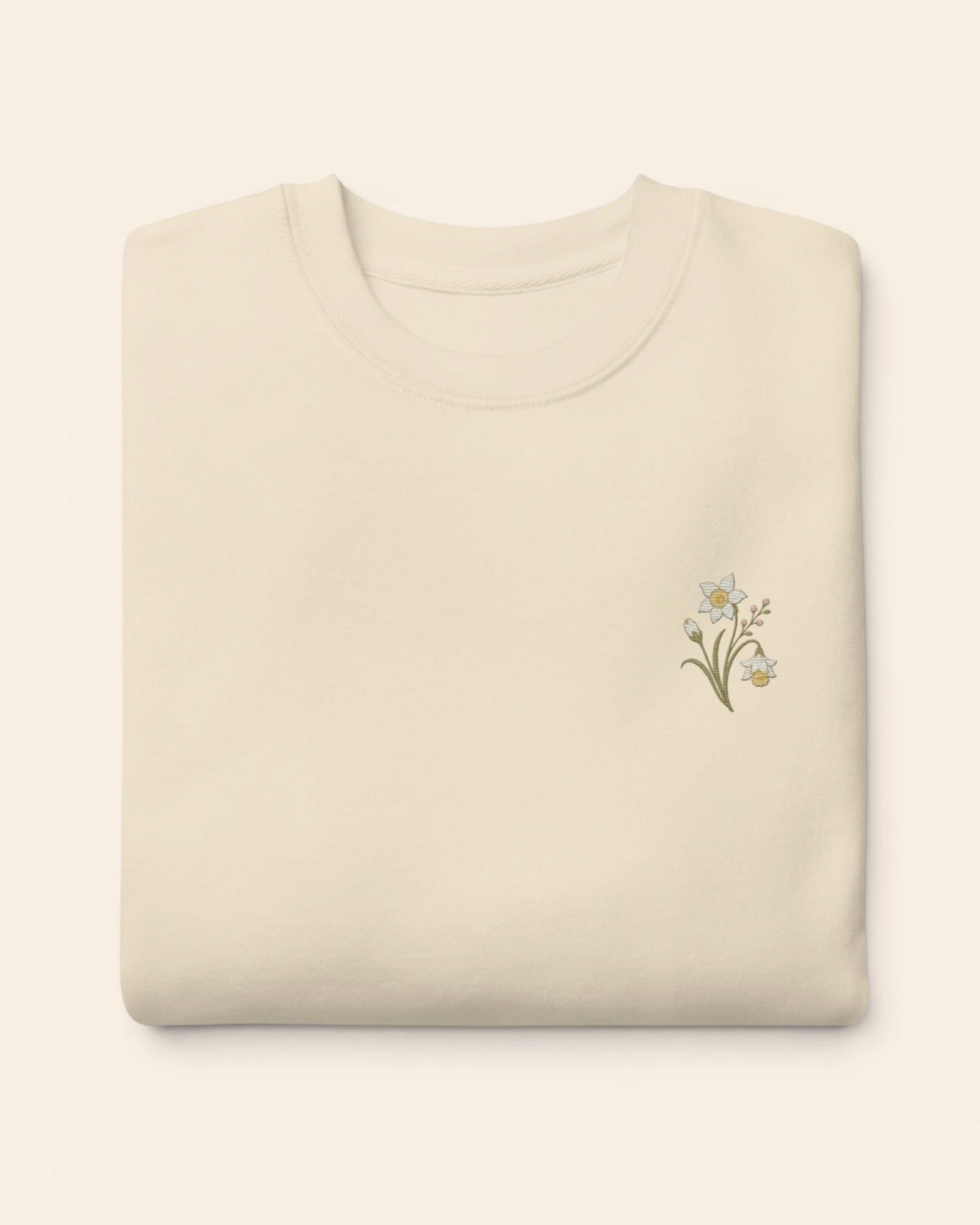 December birth flower crewneck sweatshirt with embroidered narcissus and holly, in Bone