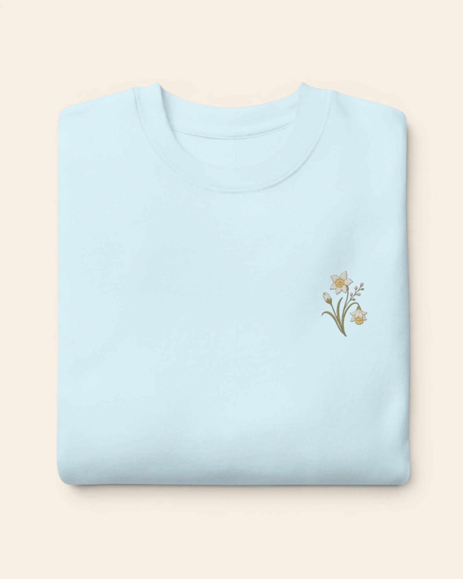 December birth flower crewneck sweatshirt with embroidered narcissus and holly, in Sky Blue
