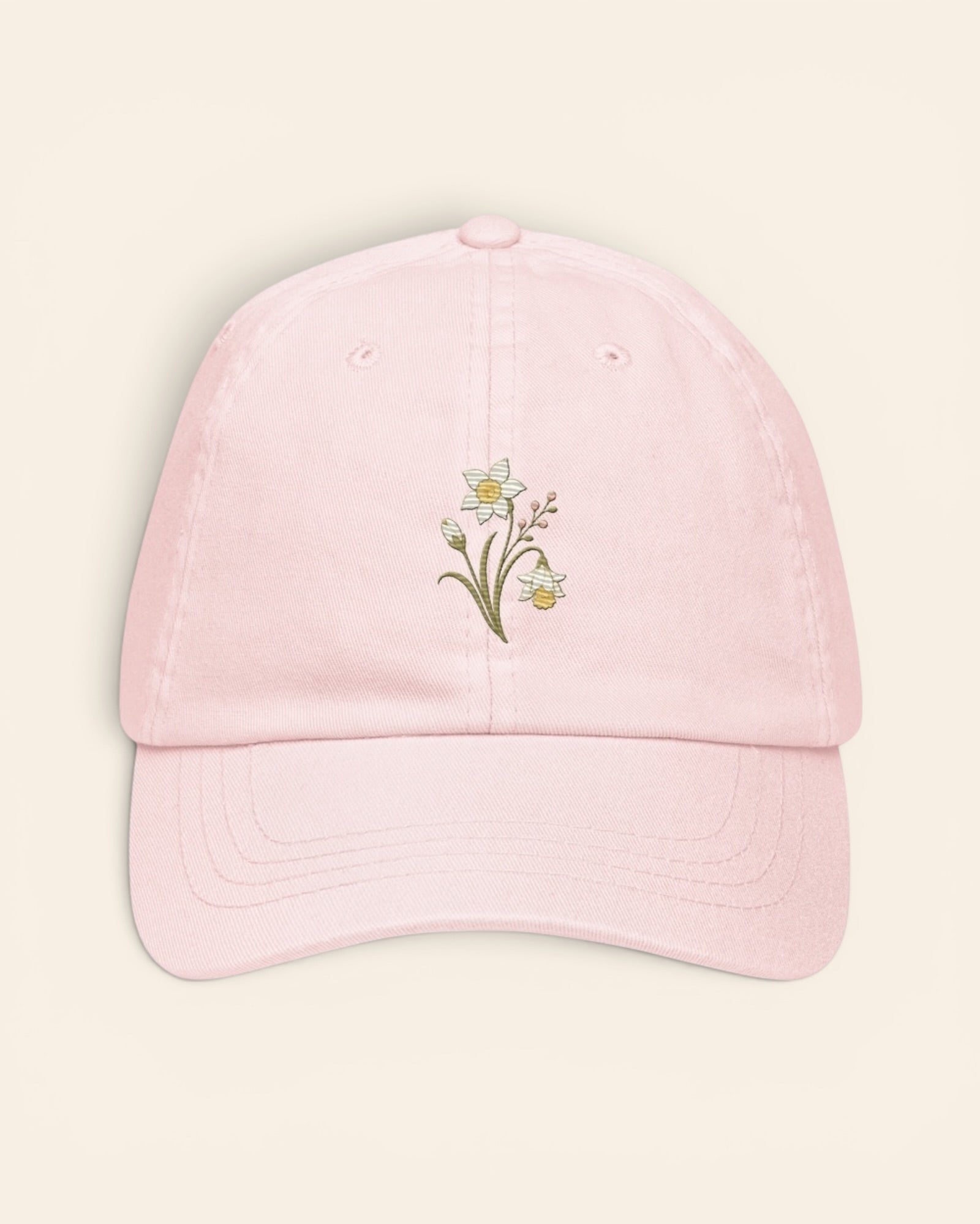 December birth flower hat with embroidered narcissus and holly, in Pastel Pink
