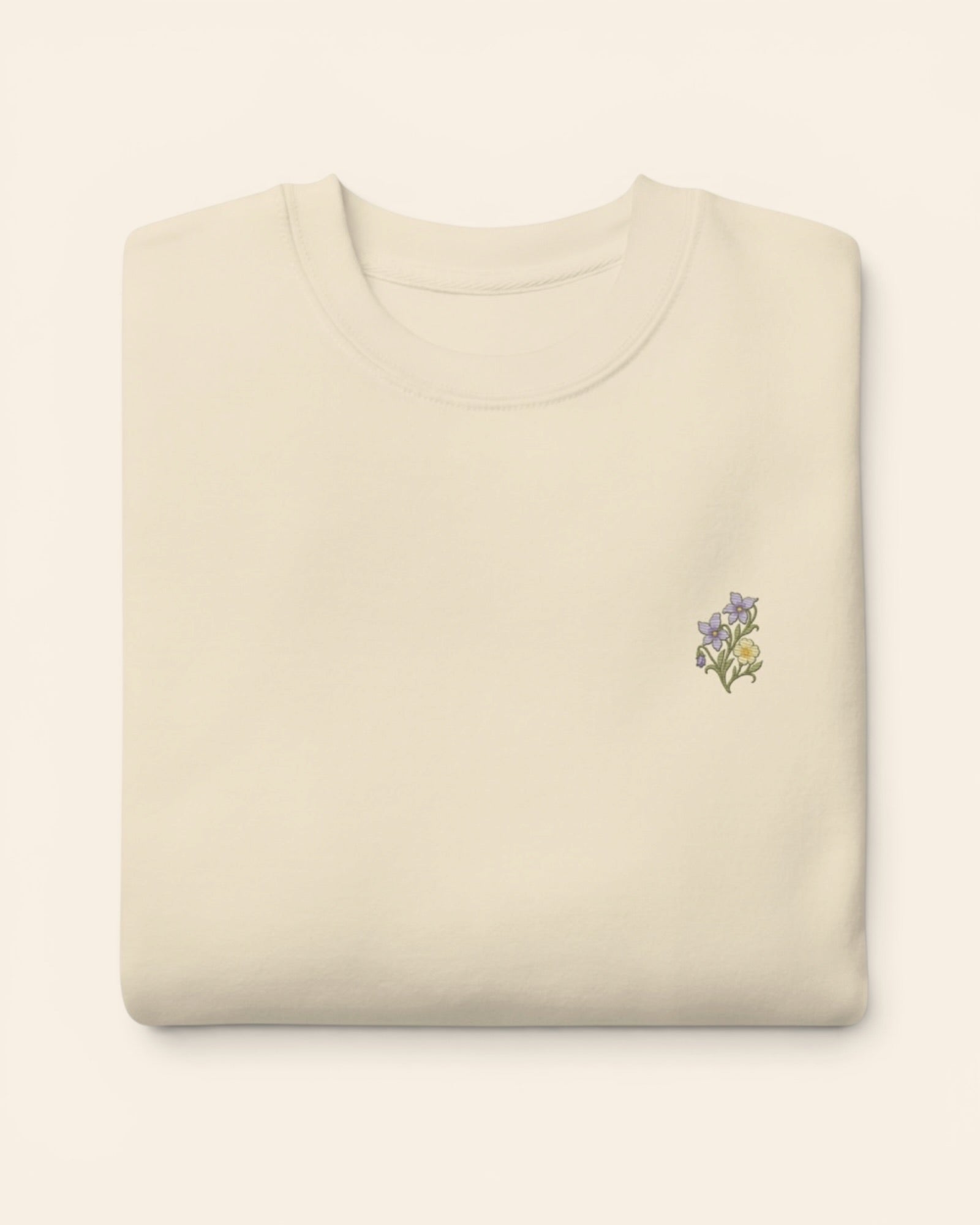February birth flower crewneck sweatshirt with embroidered violet and primrose, in Bone