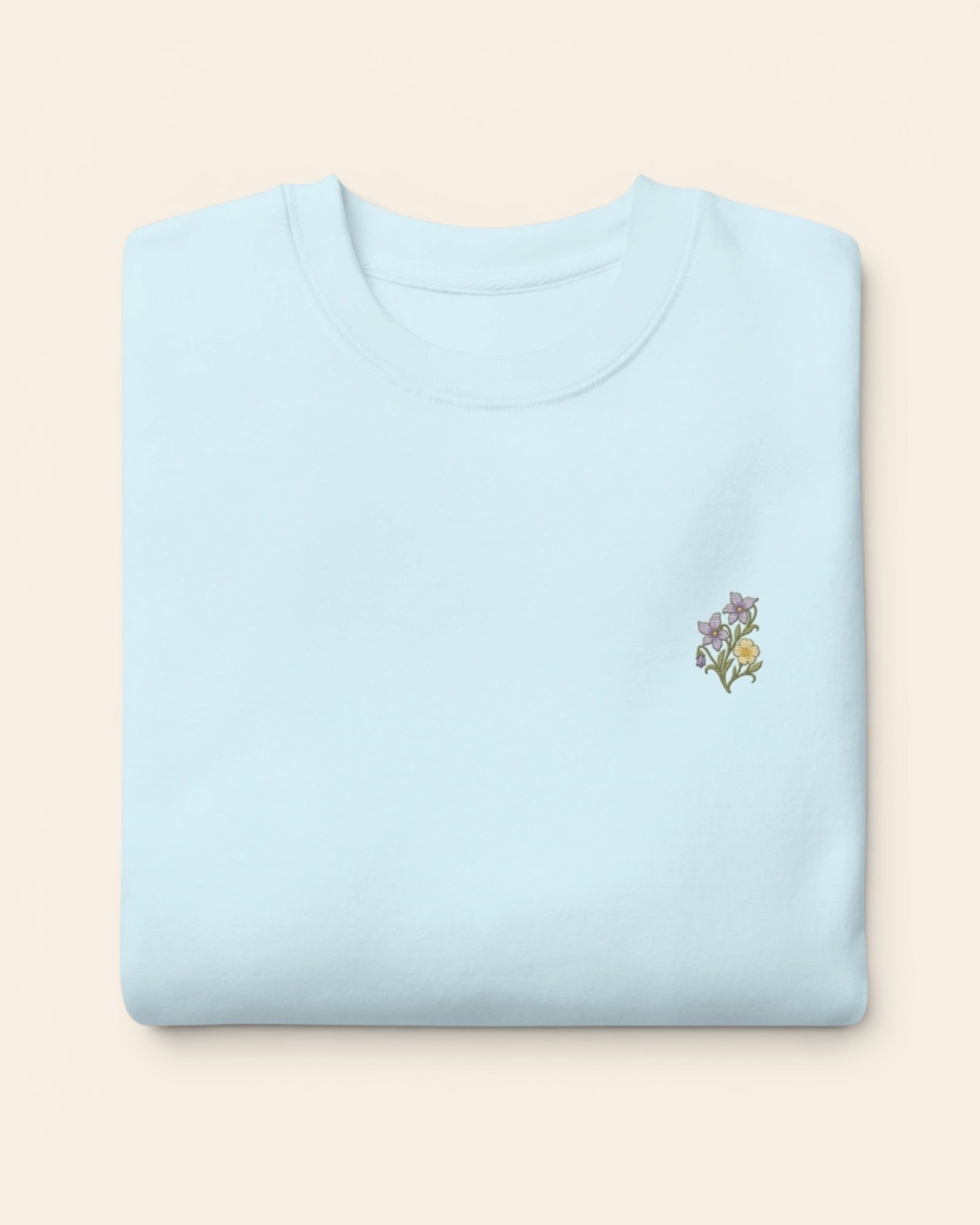 February birth flower crewneck sweatshirt with embroidered violet and primrose, in Sky Blue