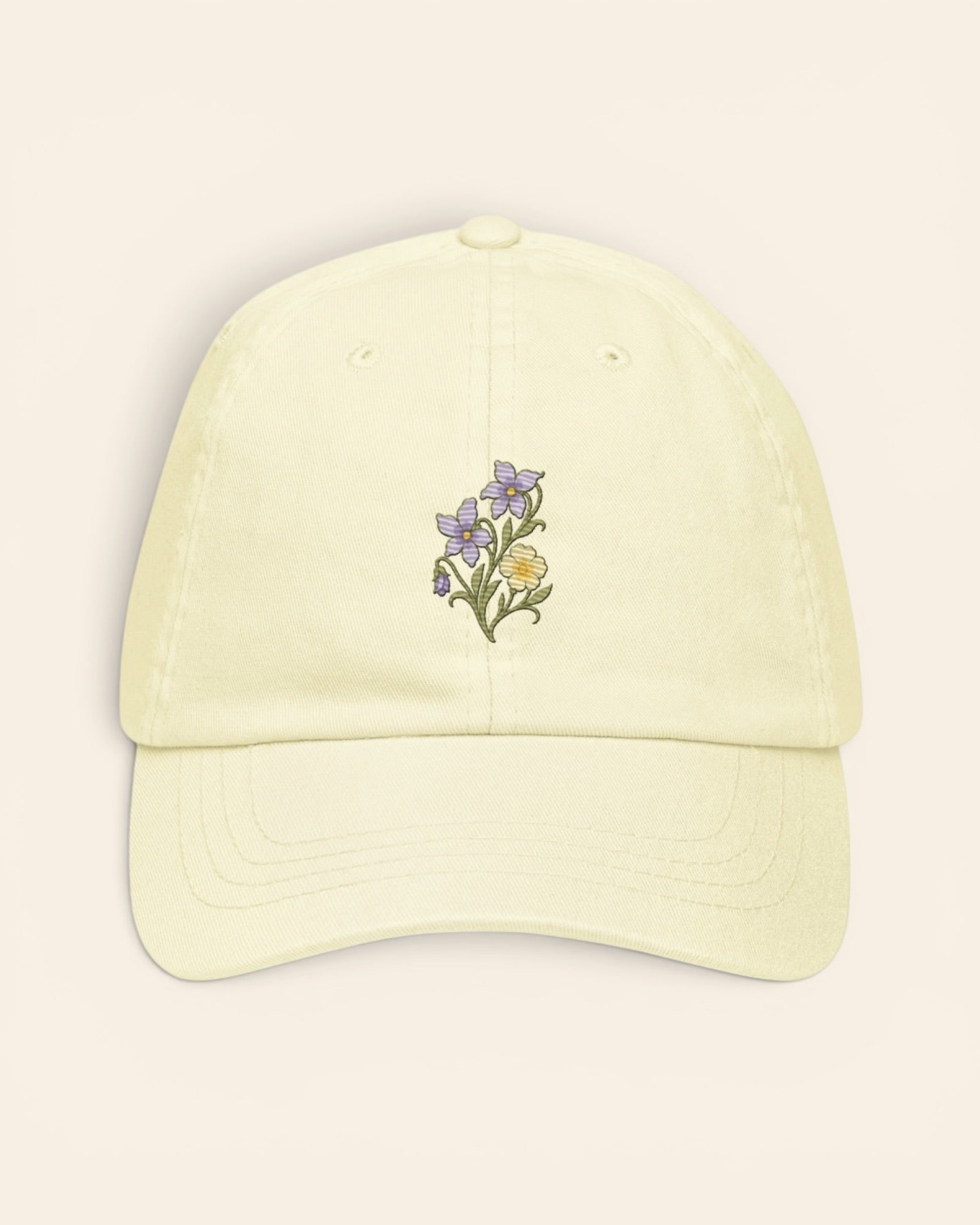February birth flower hat with embroidered violet and primrose, in Pastel Lemon