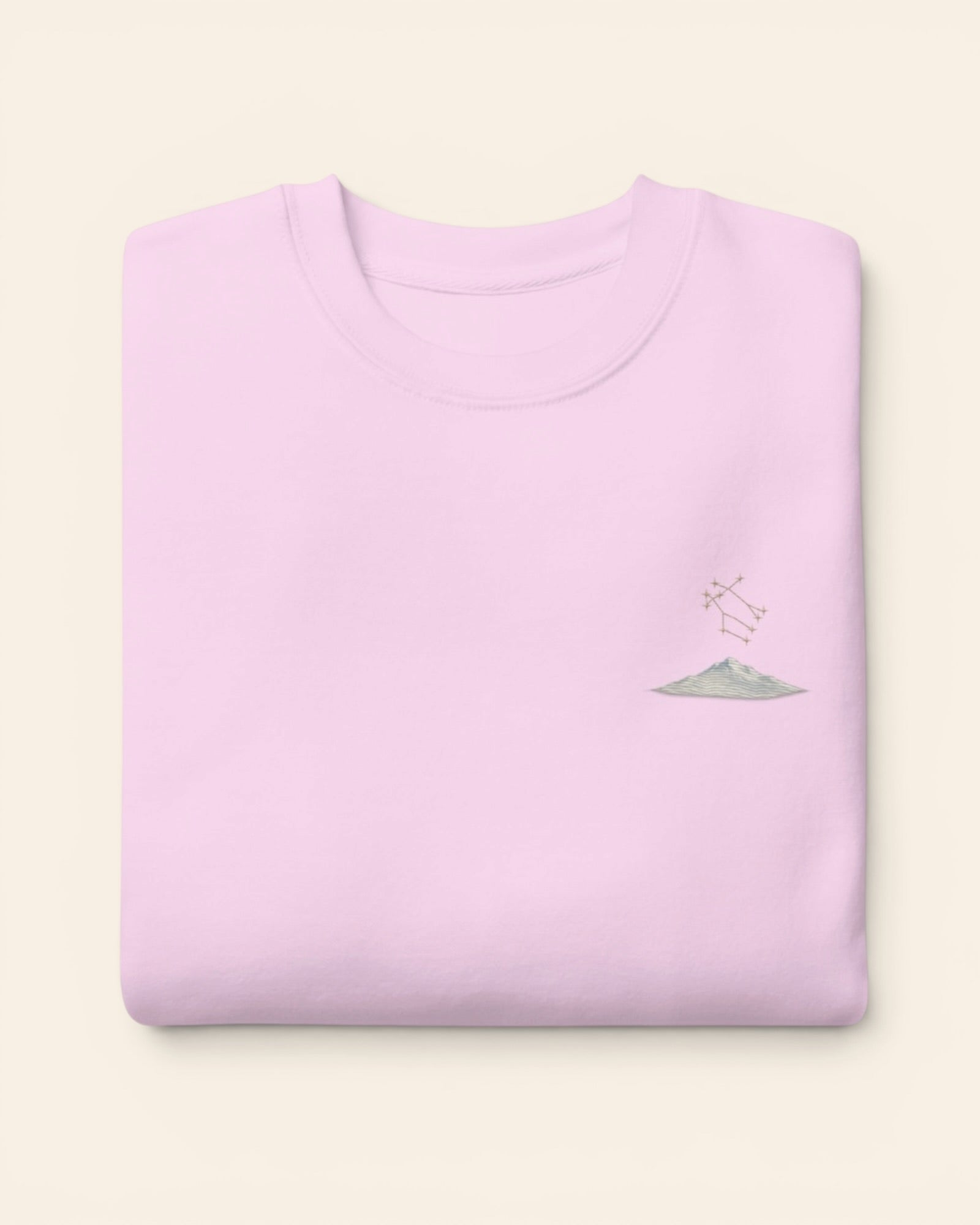 Gemini constellation crewneck sweatshirt with embroidered stars above a mountain ridge, in Lavender