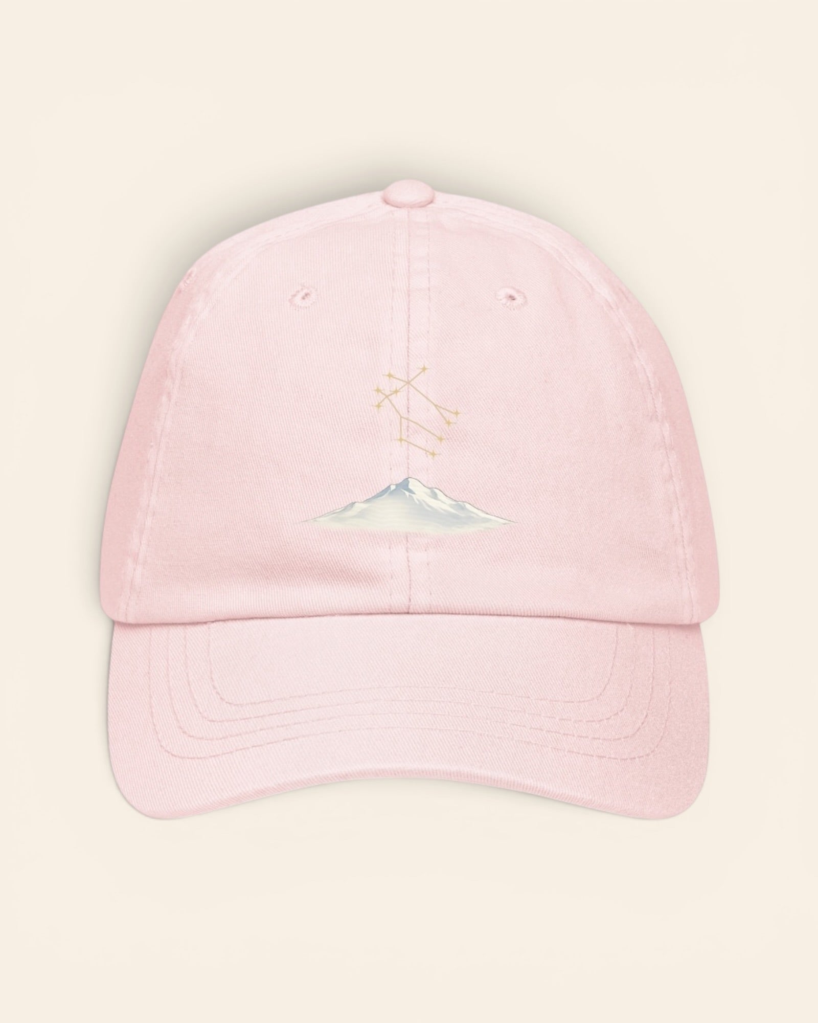 Gemini constellation hat with embroidered stars above a mountain ridge, in Pastel Pink