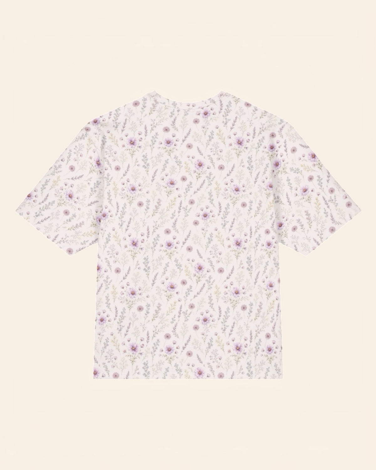 The same tee shown flat from the back on a plain cream background, with no text, so the all-over print runs unbroken across the body and sleeves. It is white, printed with lavender and mauve wildflowers on slender stems.