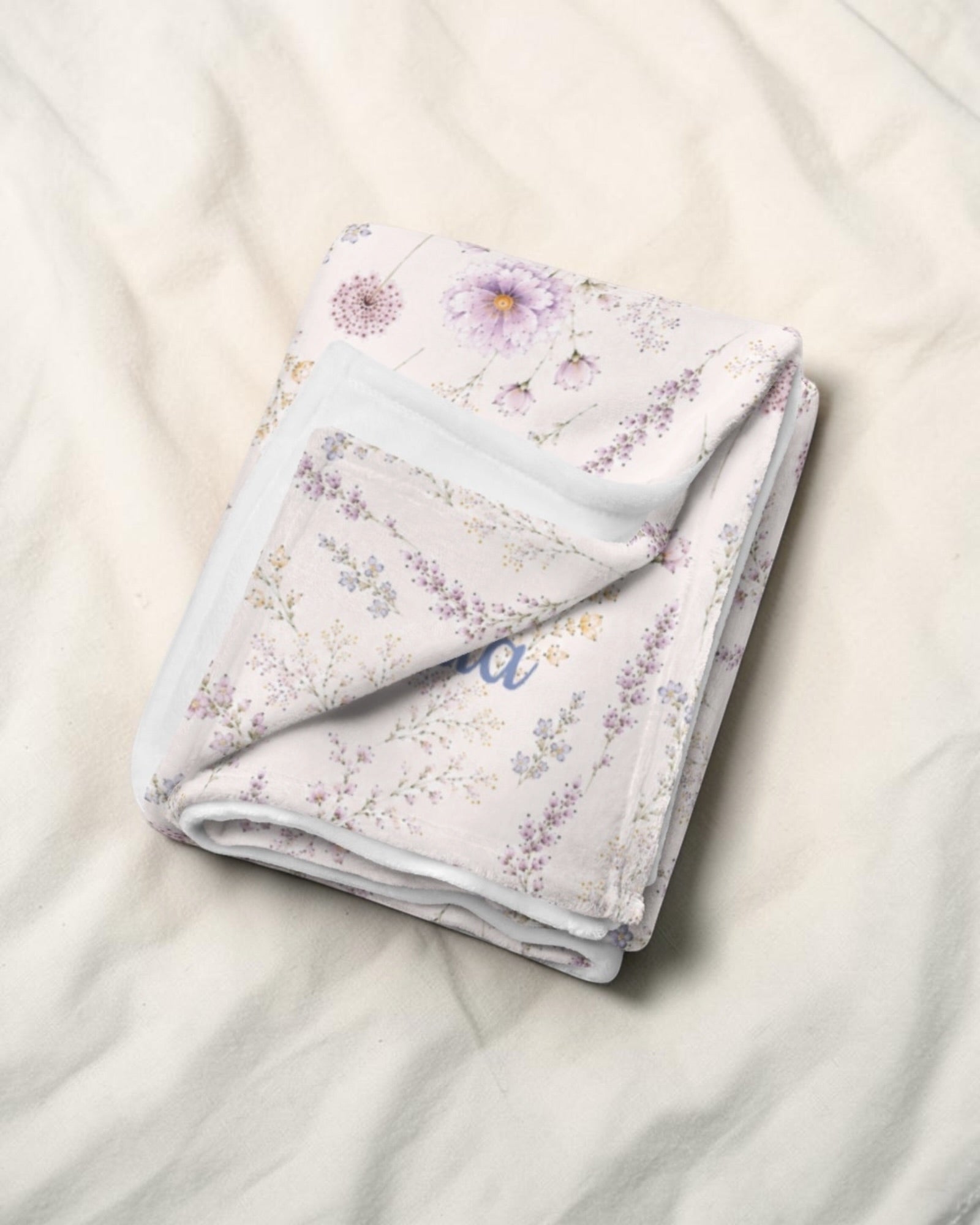 La Vie Fleurie Throw Blanket, with lavender sprigs, purple cosmos, baby's breath, and larkspur print