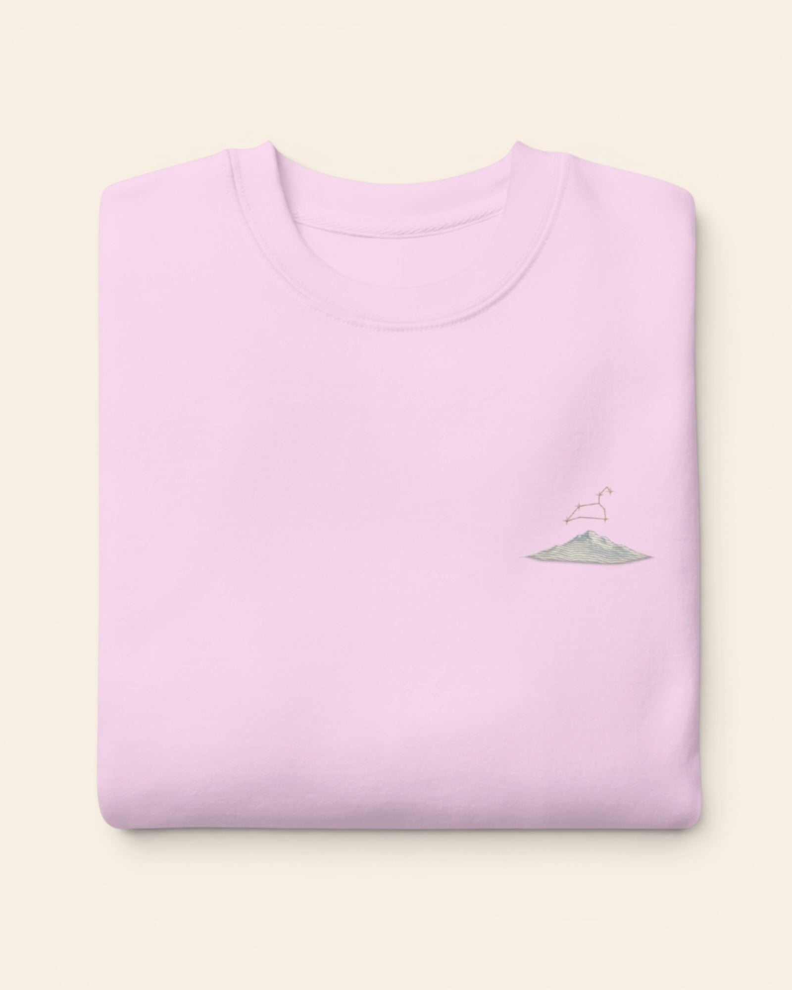 Leo constellation crewneck sweatshirt with embroidered stars above a mountain ridge, in Lavender