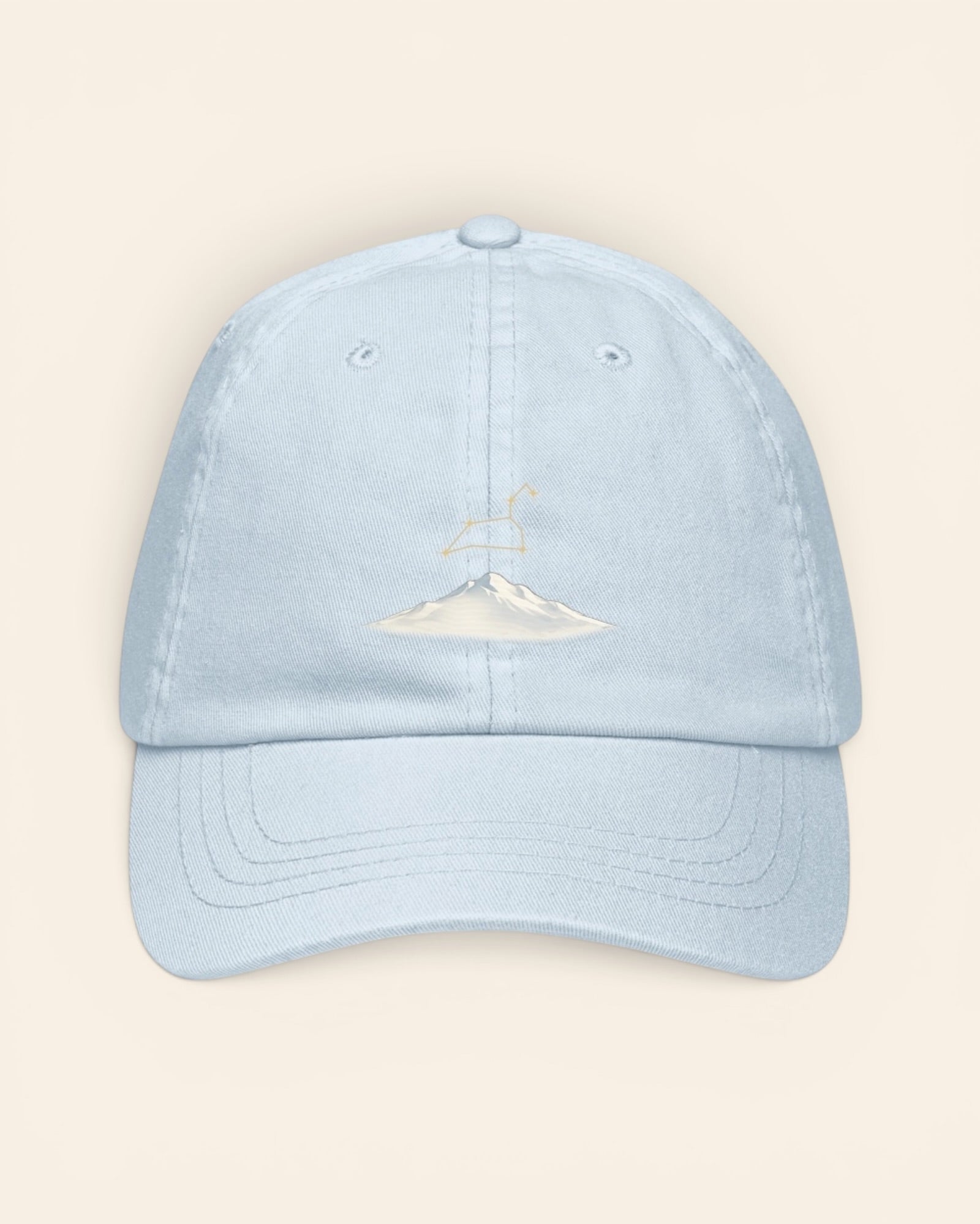 Leo constellation hat with embroidered stars above a mountain ridge, in Pastel Blue