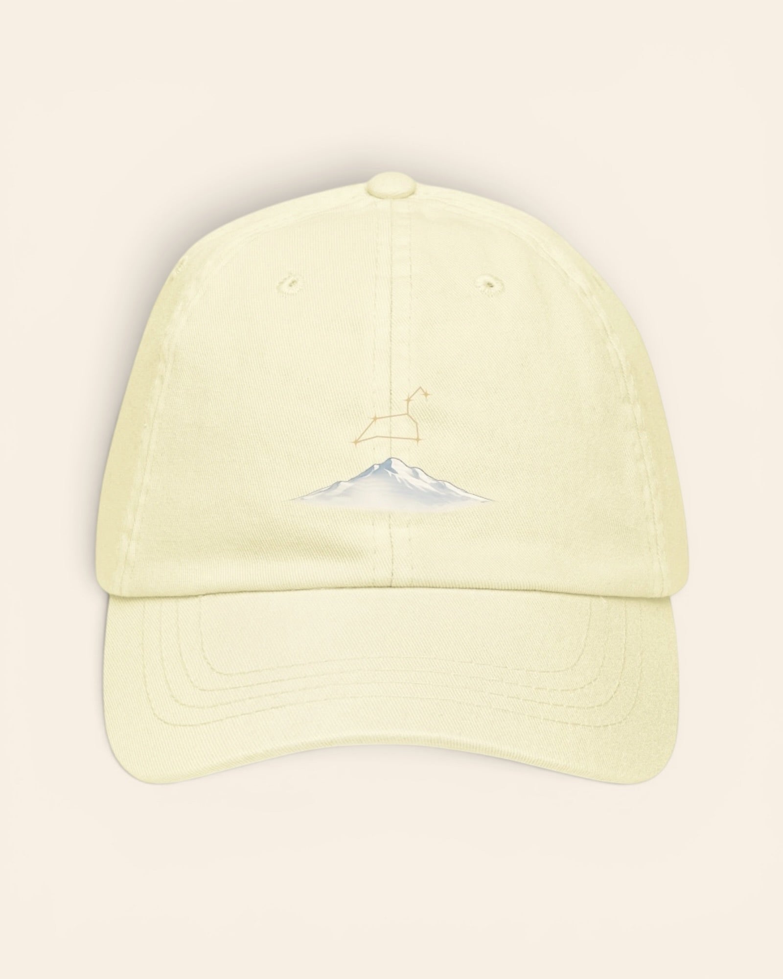 Leo constellation hat with embroidered stars above a mountain ridge, in Pastel Lemon